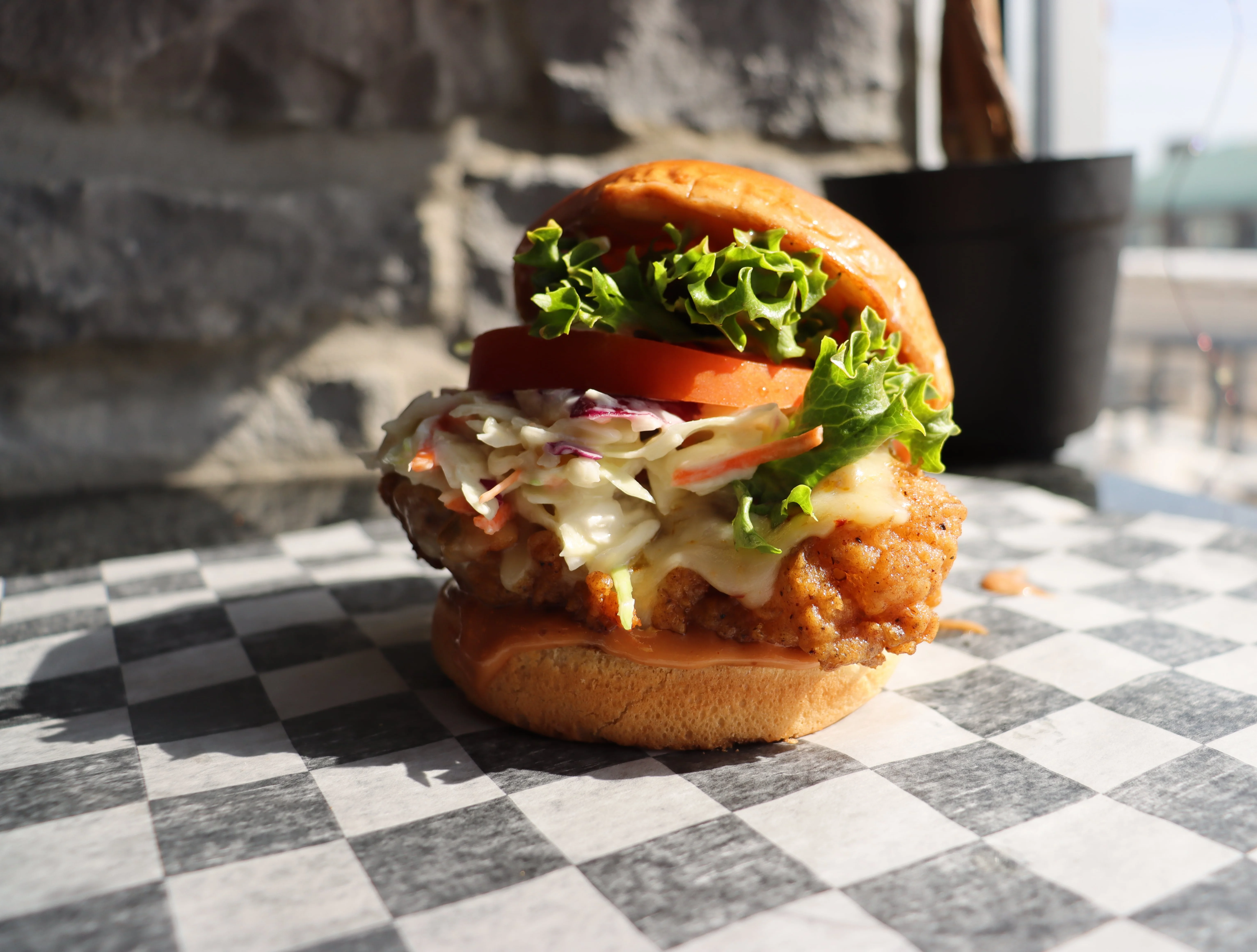 Crispy fried chicken sandwich with lettuce and tomato