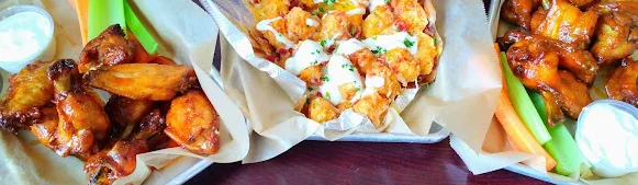 Buffalo chicken wings with celery and ranch dressing