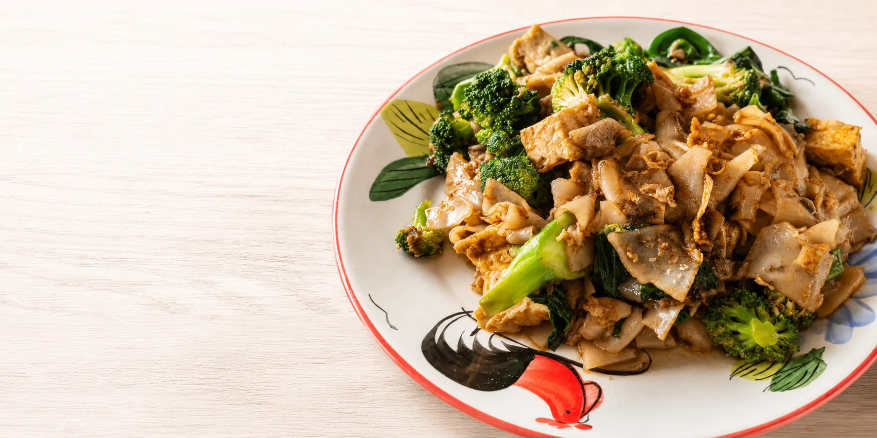 Stir-fried Thai pad see ew with broccoli