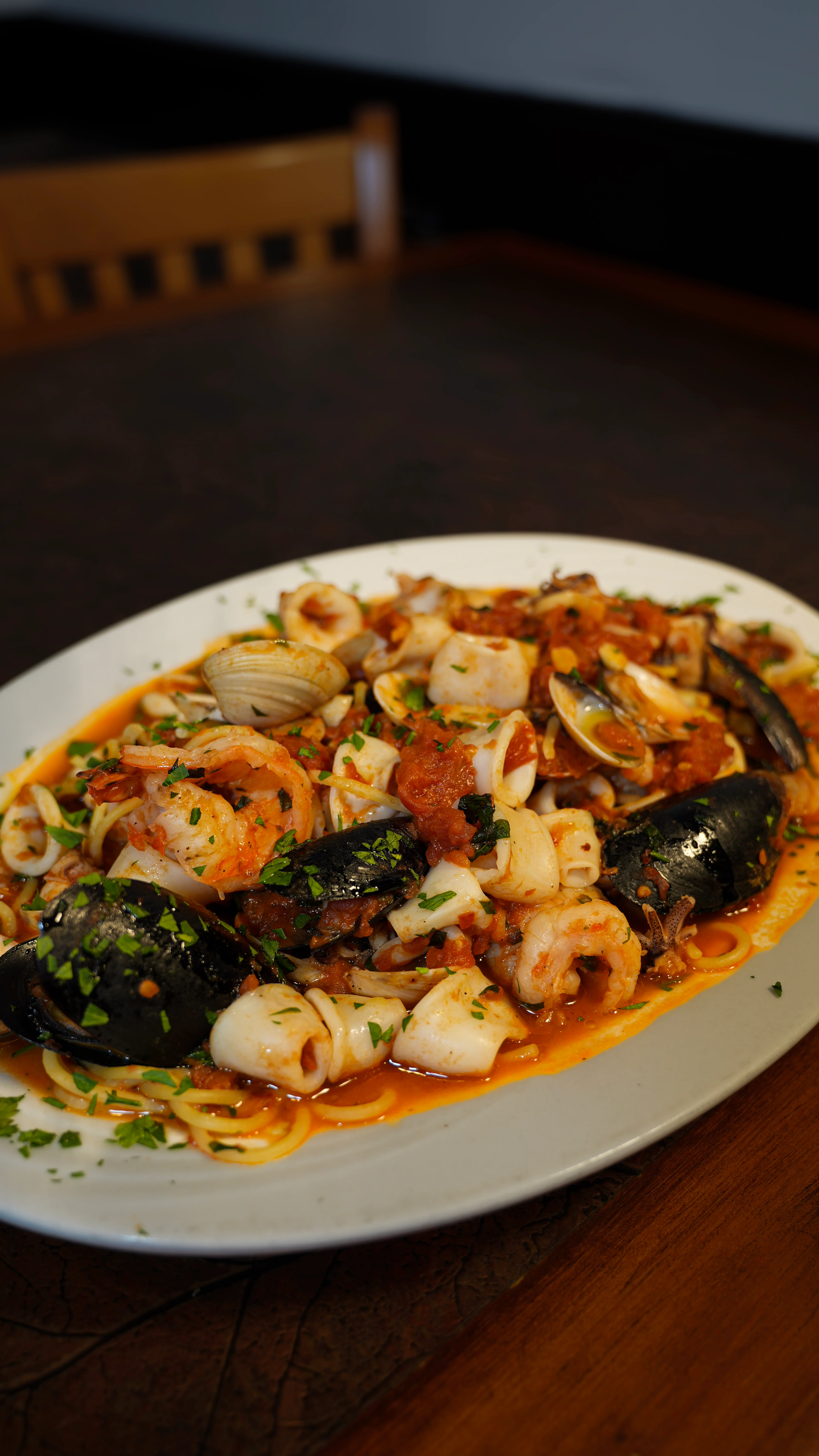 Seafood linguine with shrimp, clams, and mussels in marinara sauce