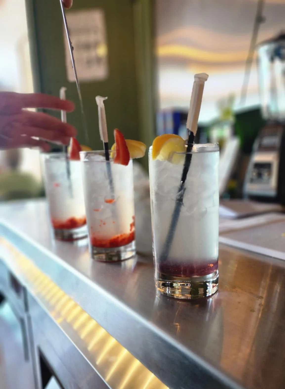 Bartender preparing refreshing cocktails at a stylish bar