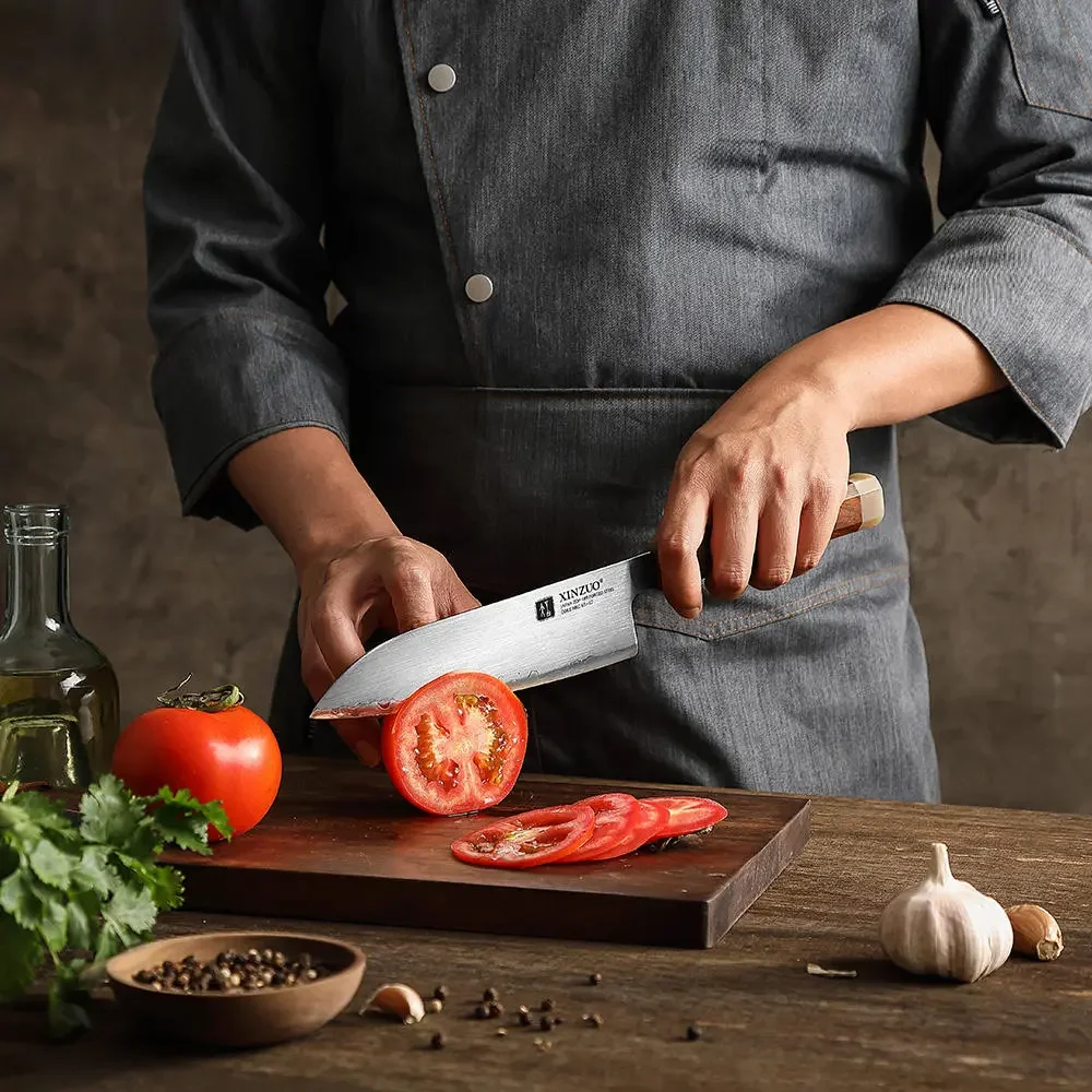 Chef slicing fresh tomatoes for a culinary dish