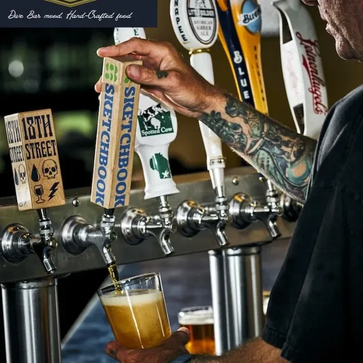 A bartender getting beer