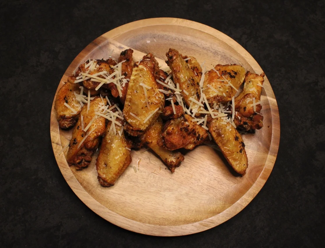 Crispy Italian chicken wings topped with cheese