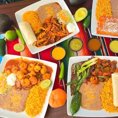 Colorful Mexican platters with shrimp and chicken fajitas