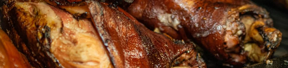 Smoked pork hocks in a barbecue pit