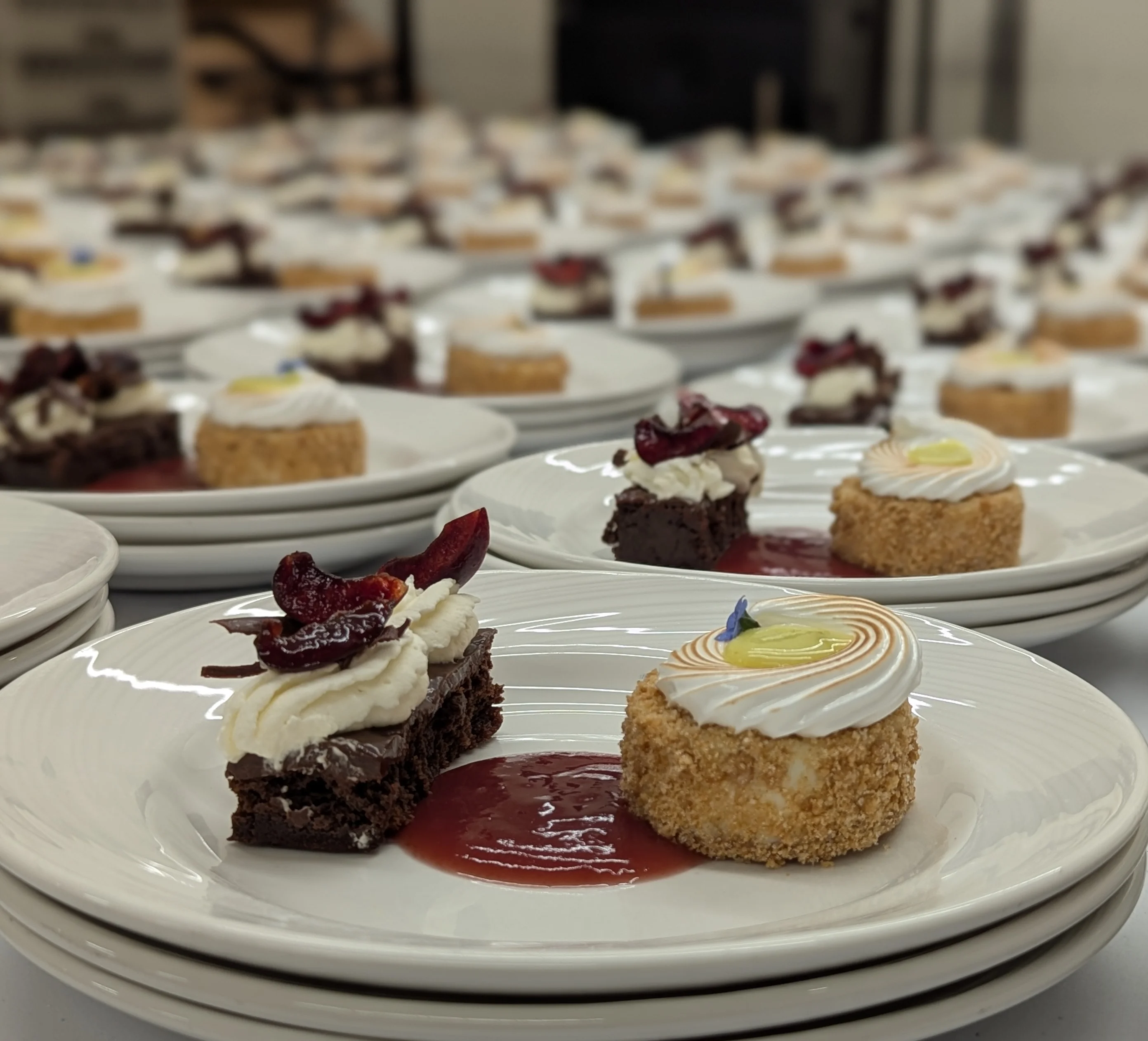 Plated desserts featuring chocolate brownie and lemon cheesecake
