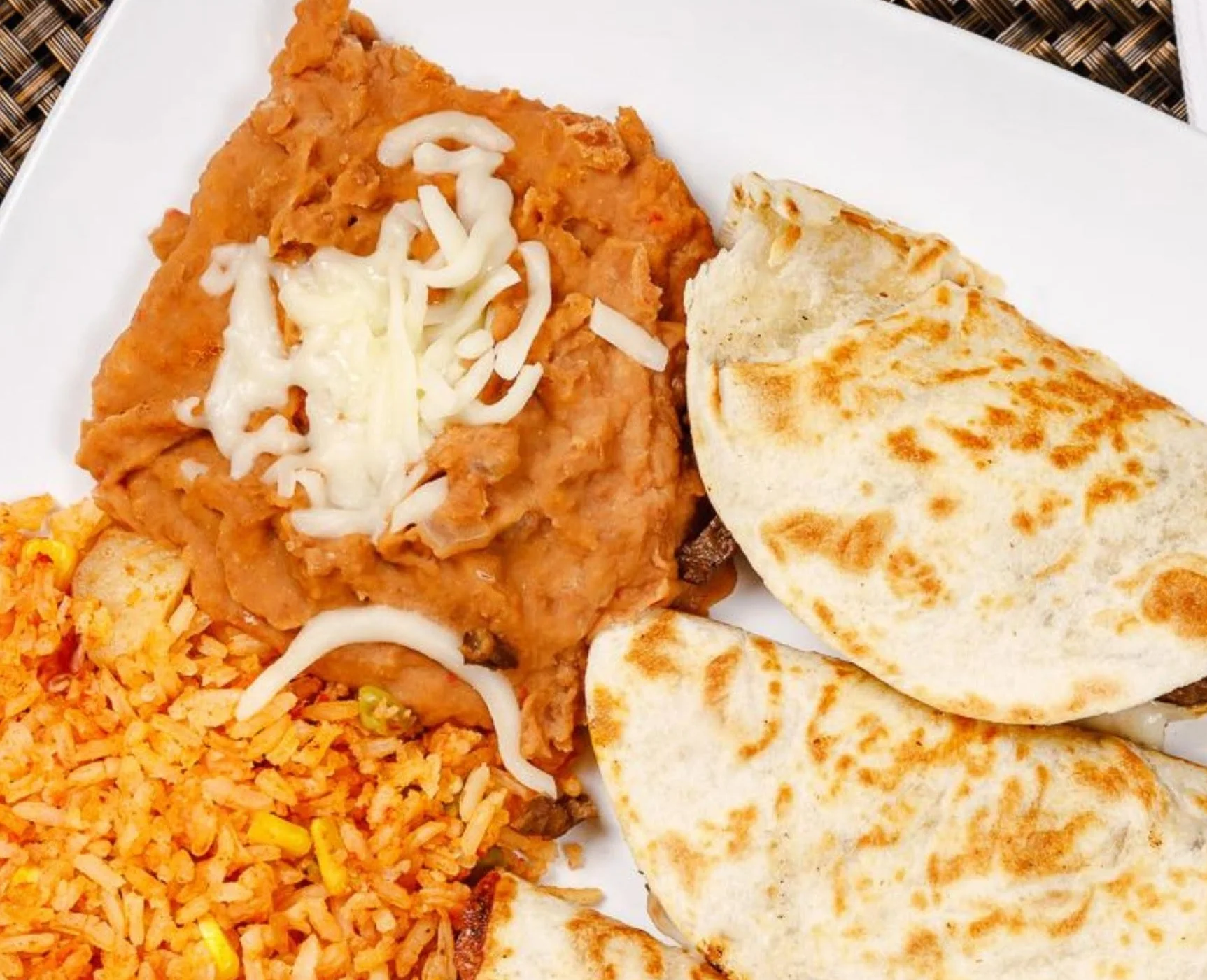 Delicious Mexican quesadillas with refried beans and rice