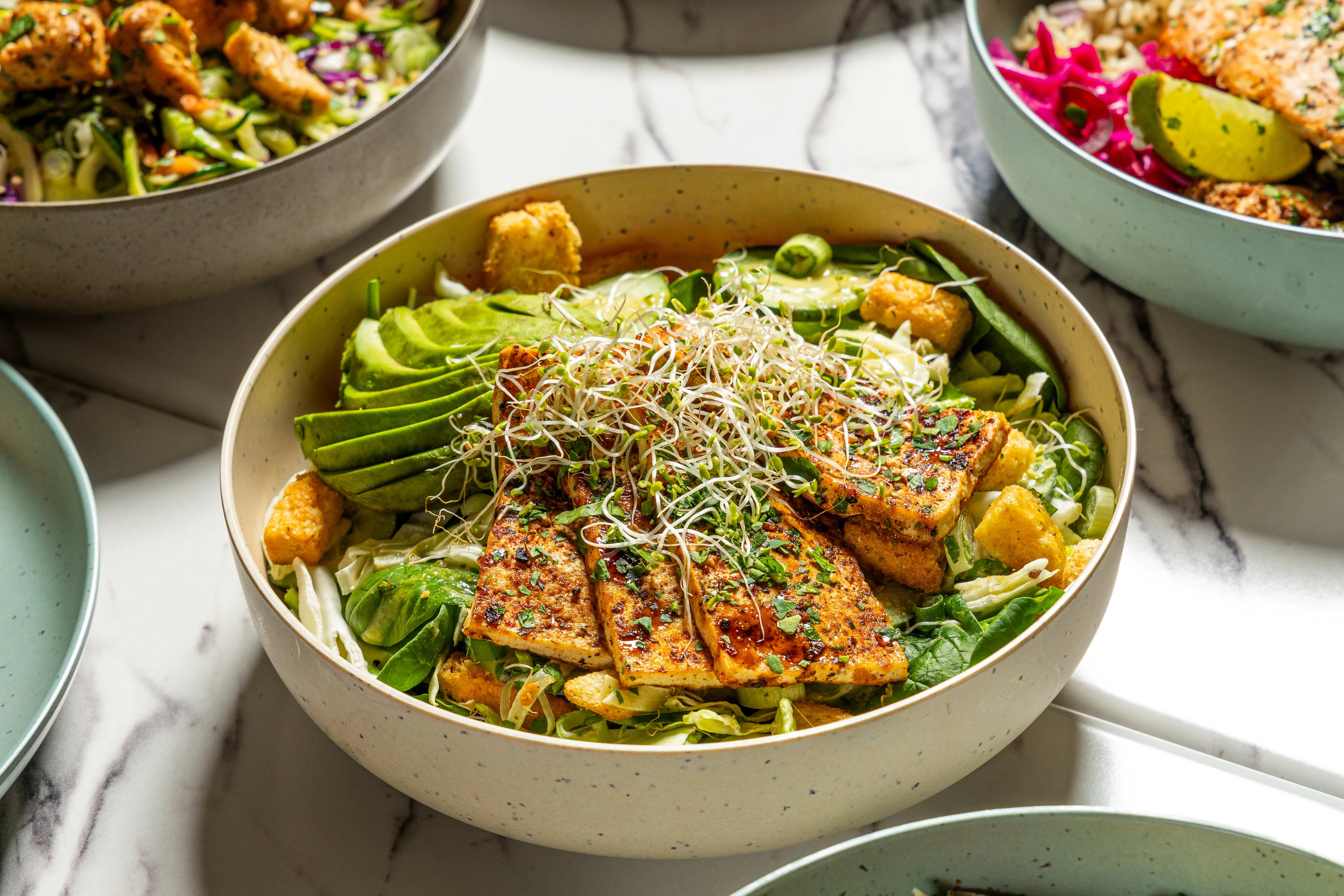 Vegan Buddha bowl with grilled tofu and fresh vegetables