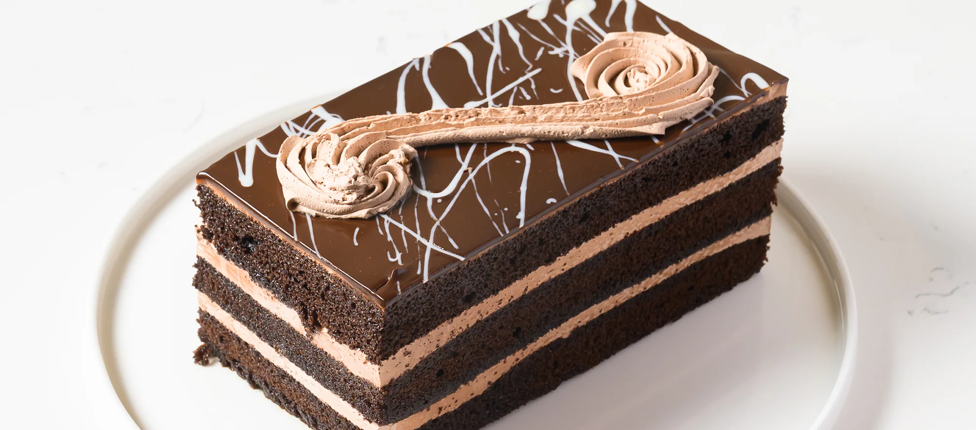 Decadent chocolate layer cake with creamy frosting