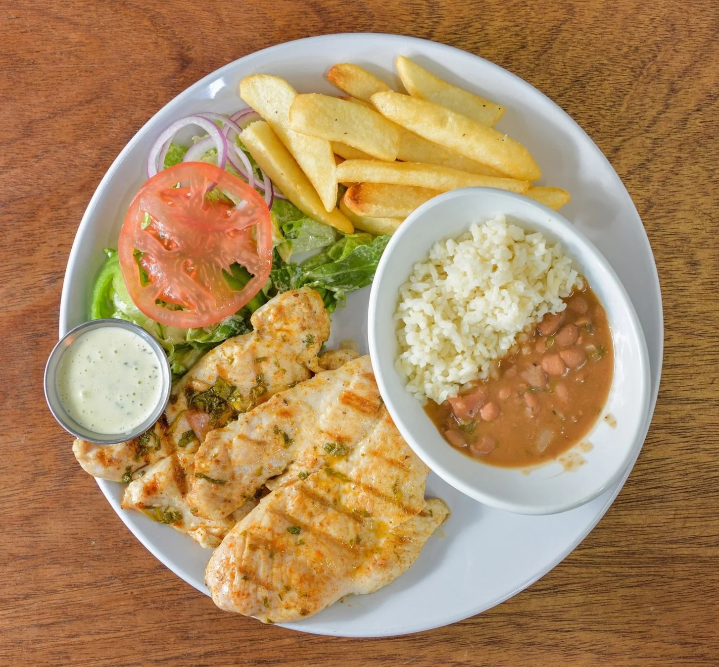 Grilled chicken dish served with vegetables on a plate