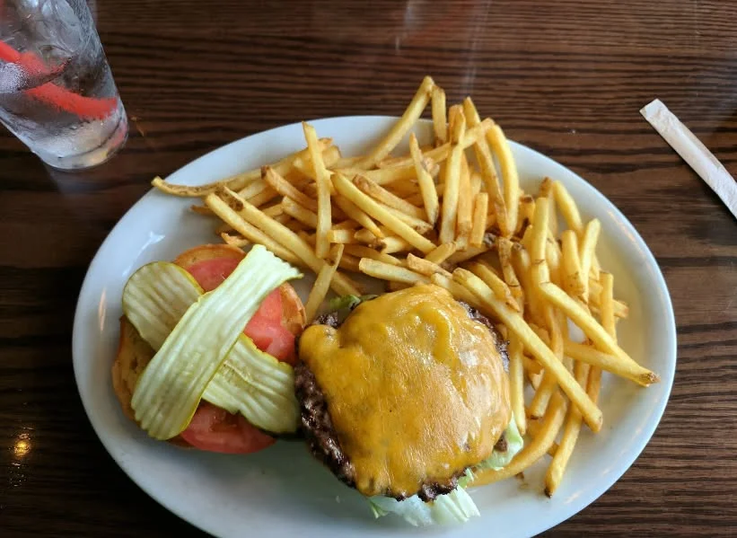 Classic American cheeseburger with fries