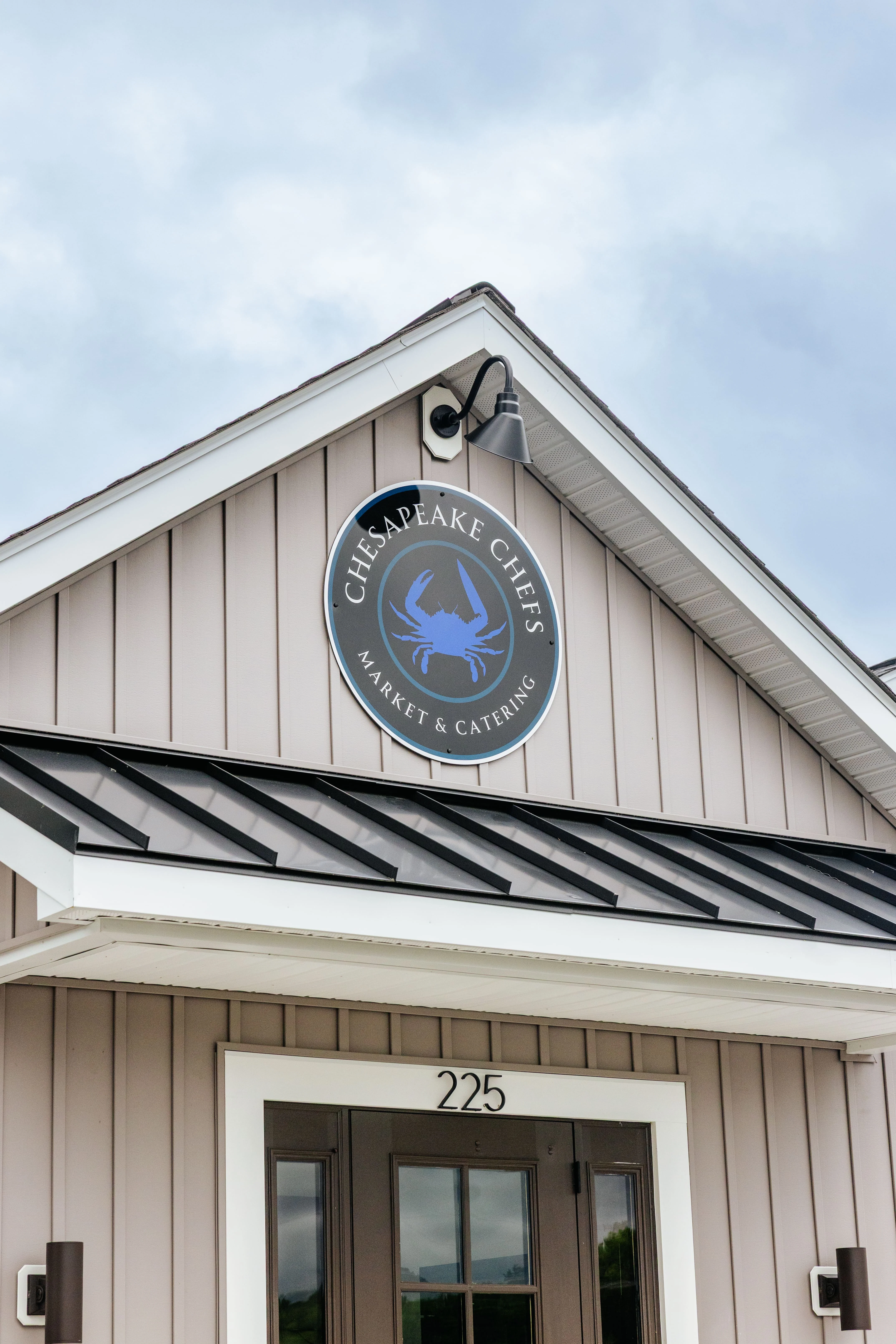 Exterior of Chesapeake Chefs Market & Catering with crab logo