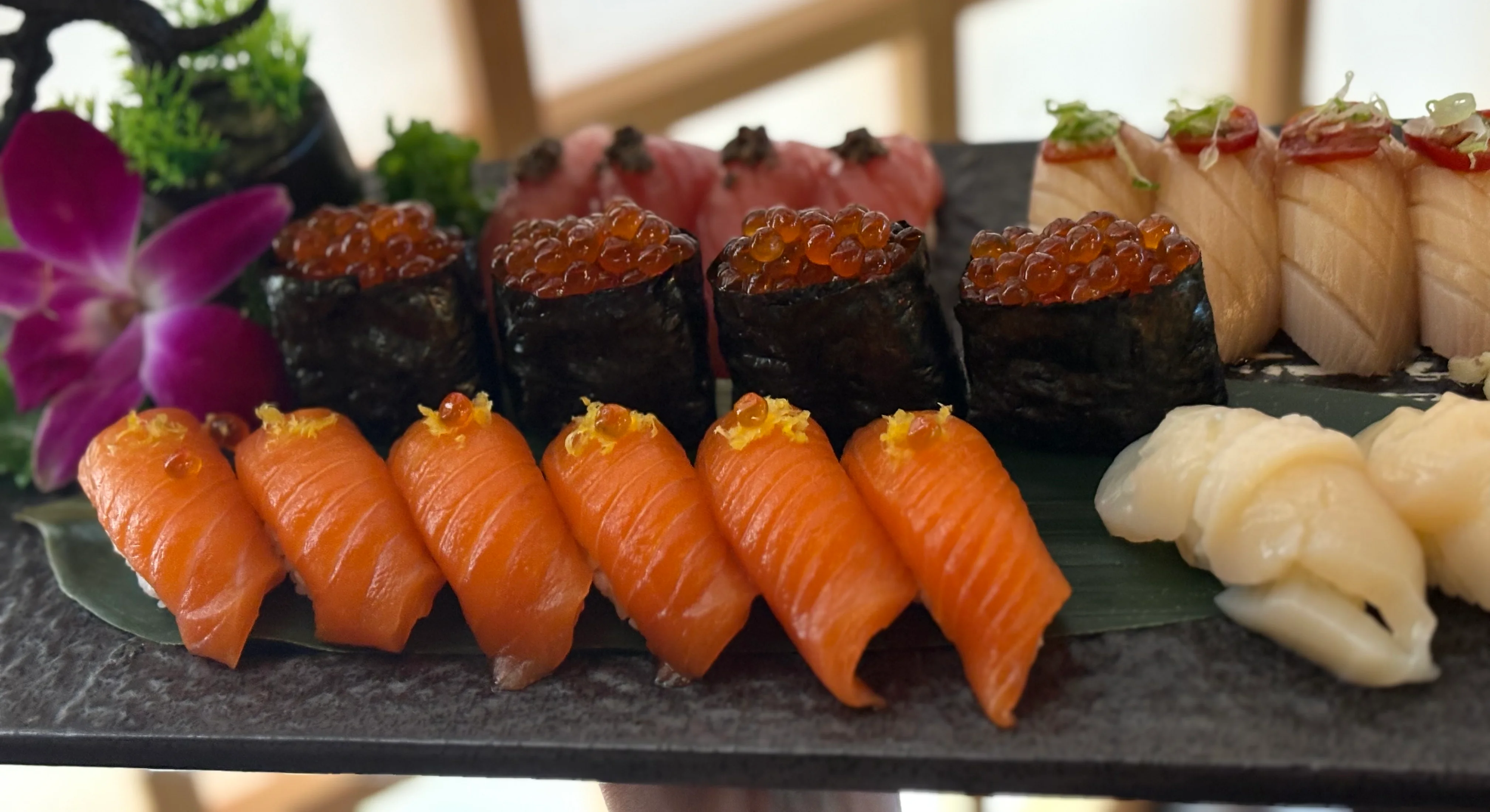 Assorted sushi platter featuring nigiri and maki rolls
