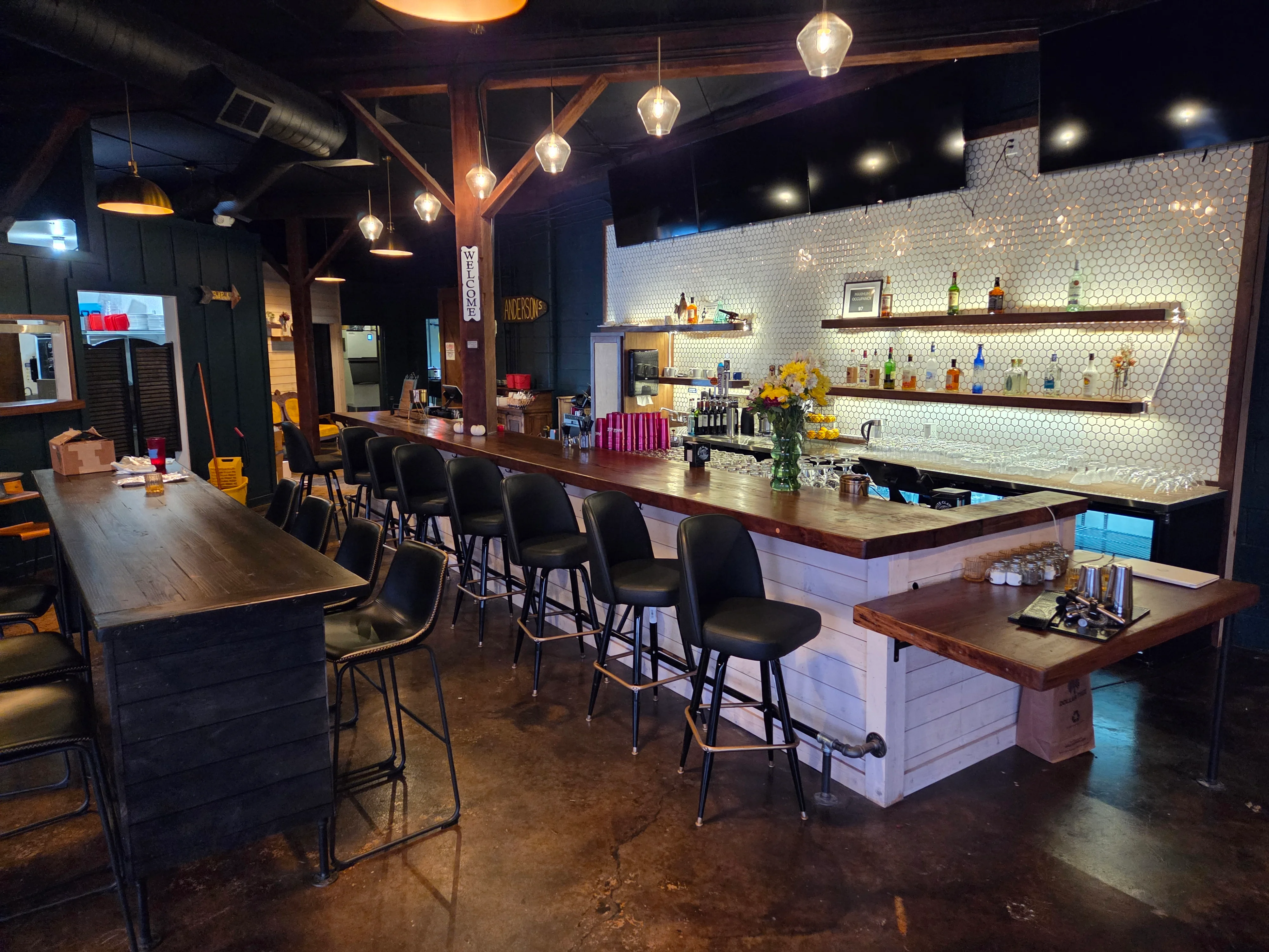 Modern bar interior with stylish seating and warm lighting