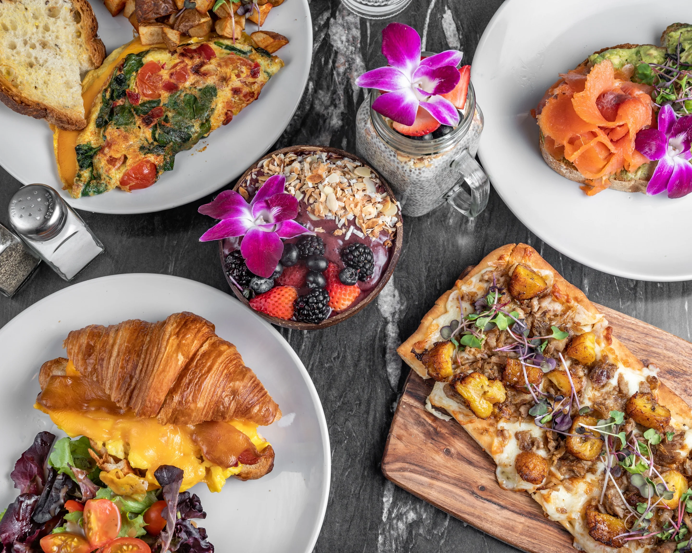 Brunch spread featuring avocado toast and omelette