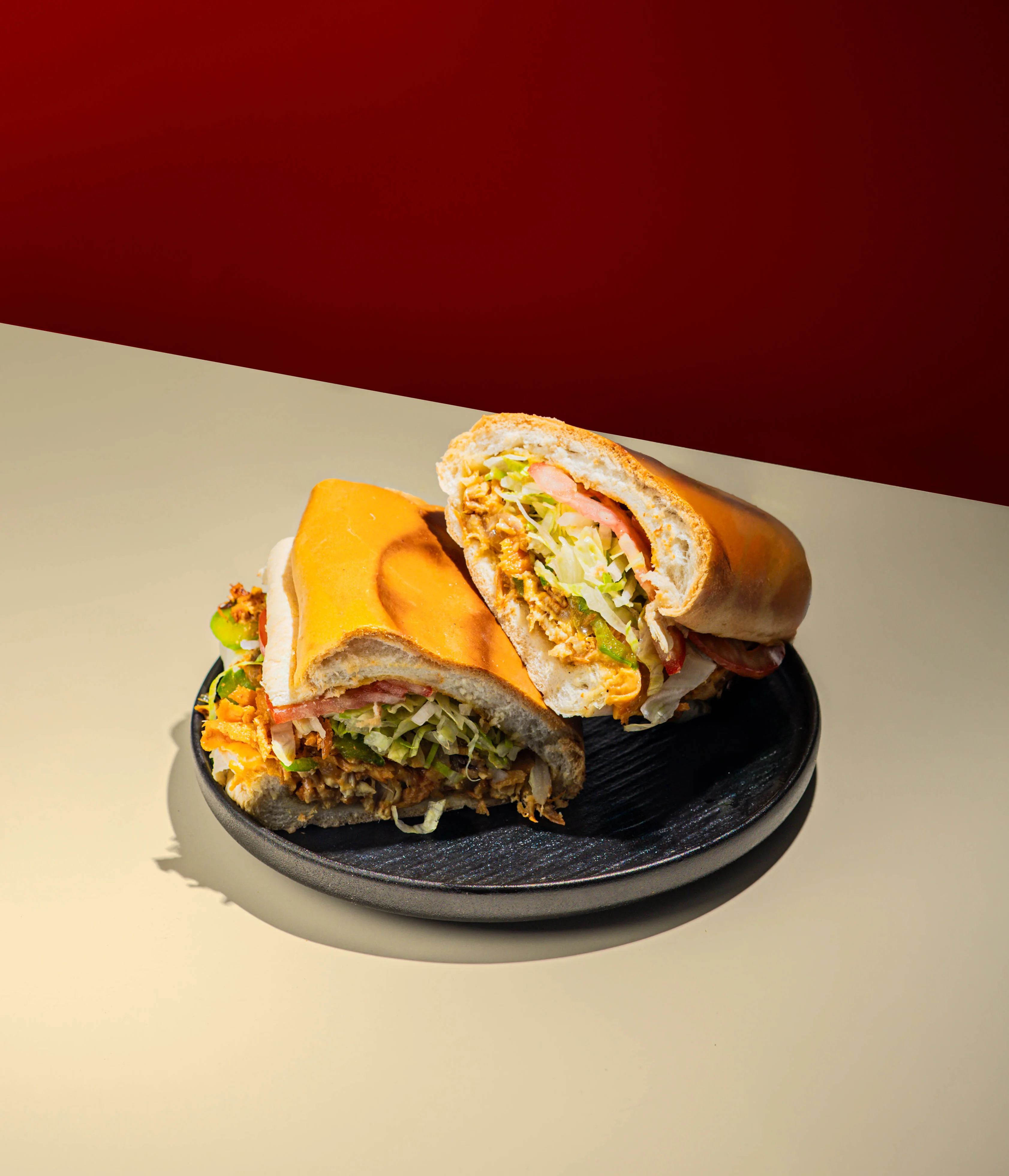 Cuban sandwich with layers of meat and fresh vegetables