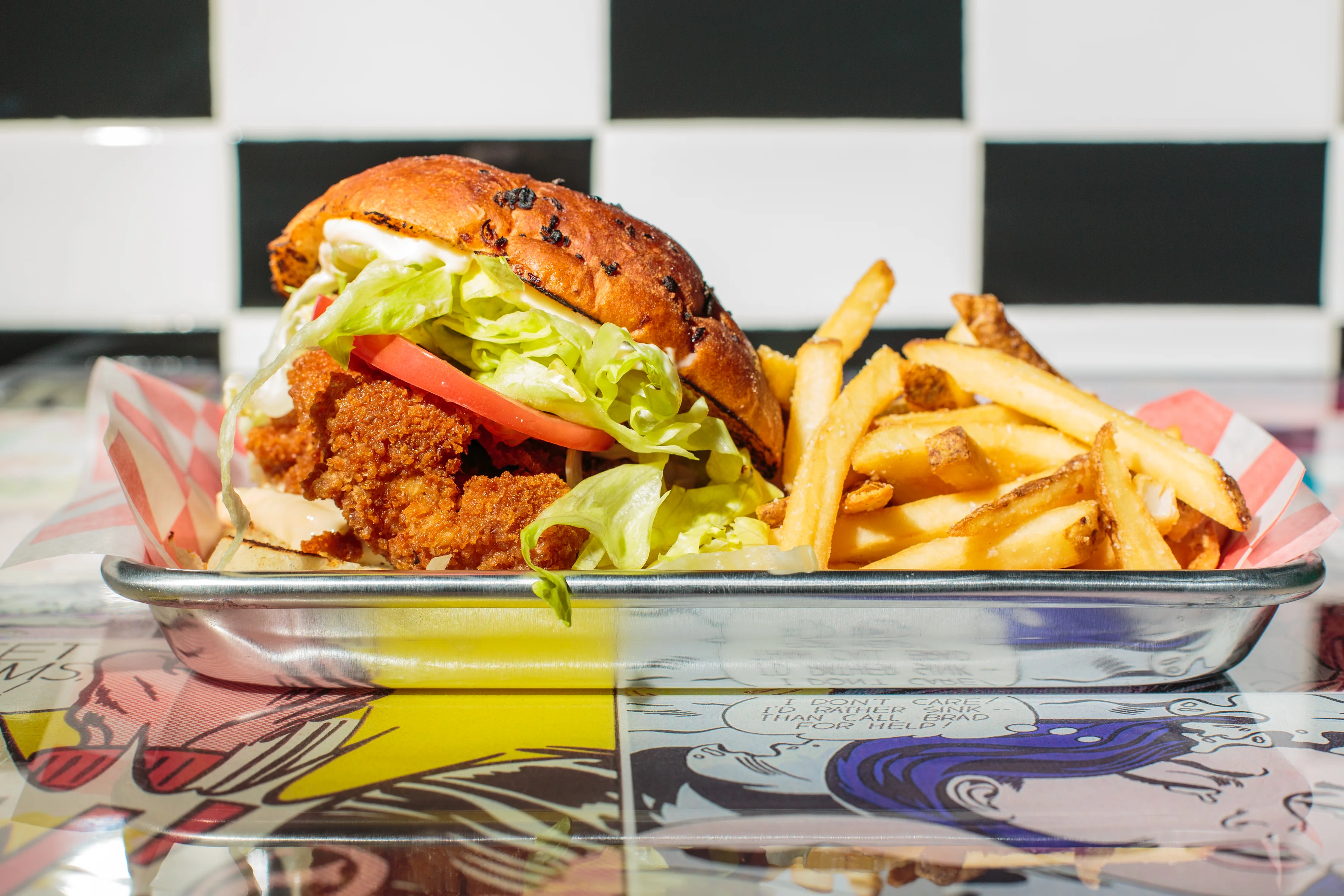 Crispy fried chicken sandwich with fries