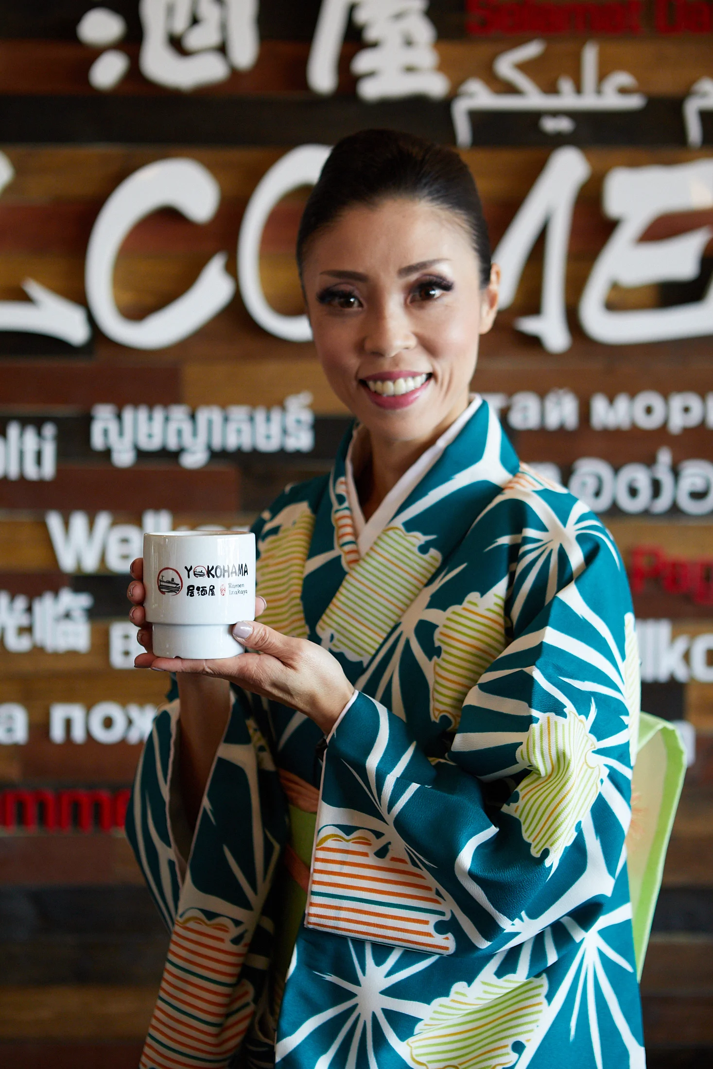 A beautiful Japanese woman holding a cup