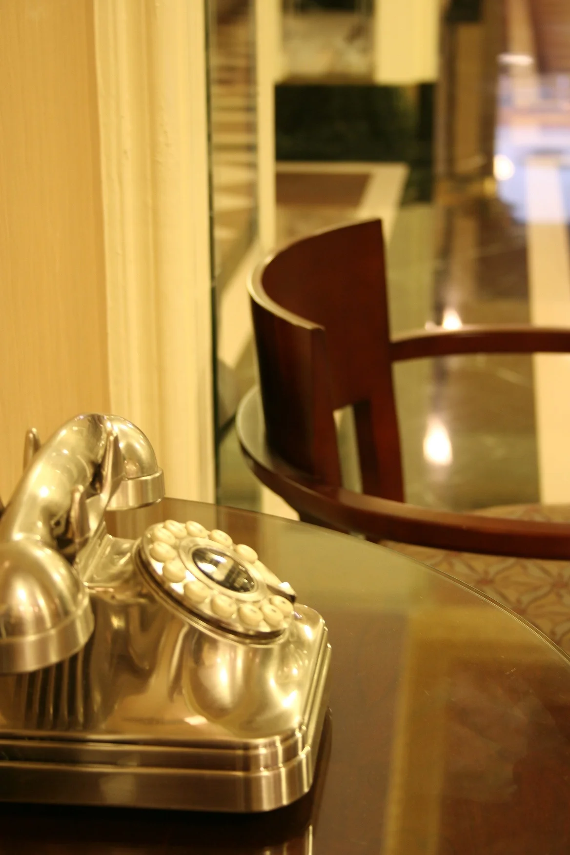 Vintage rotary phone on a polished table