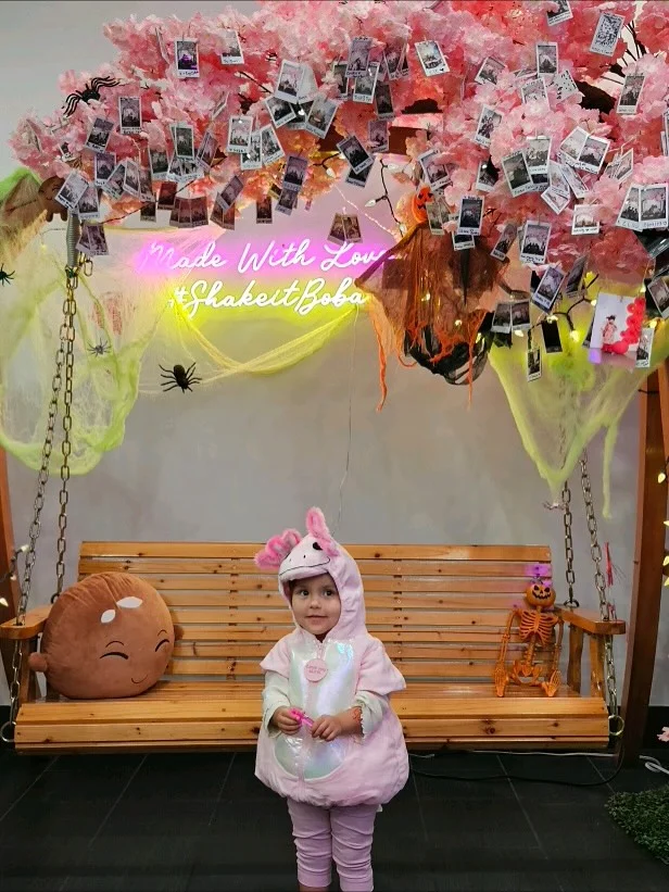 A child in a Halloween costume at ShakeiT Boba