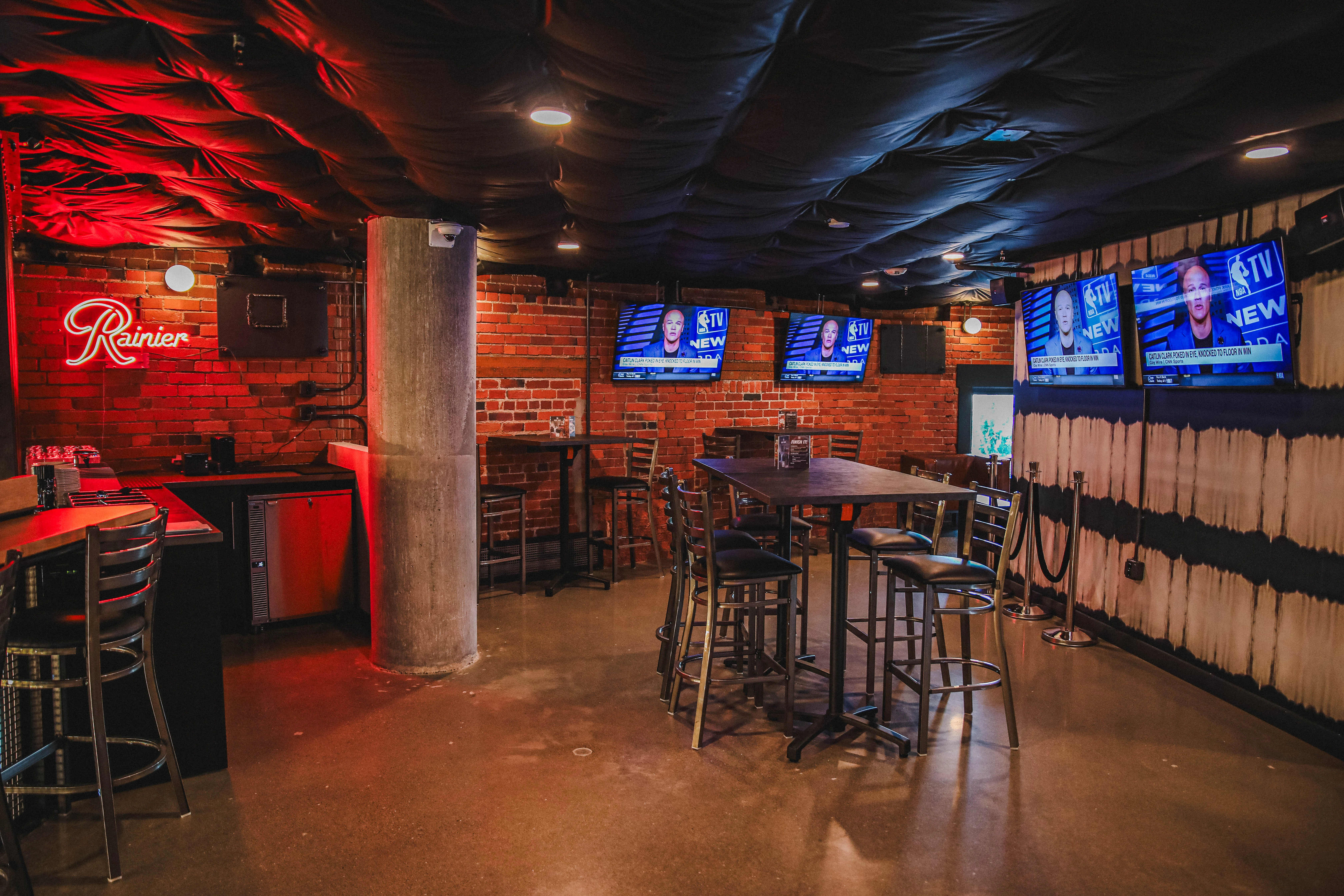 Cozy bar interior with exposed brick and modern lighting