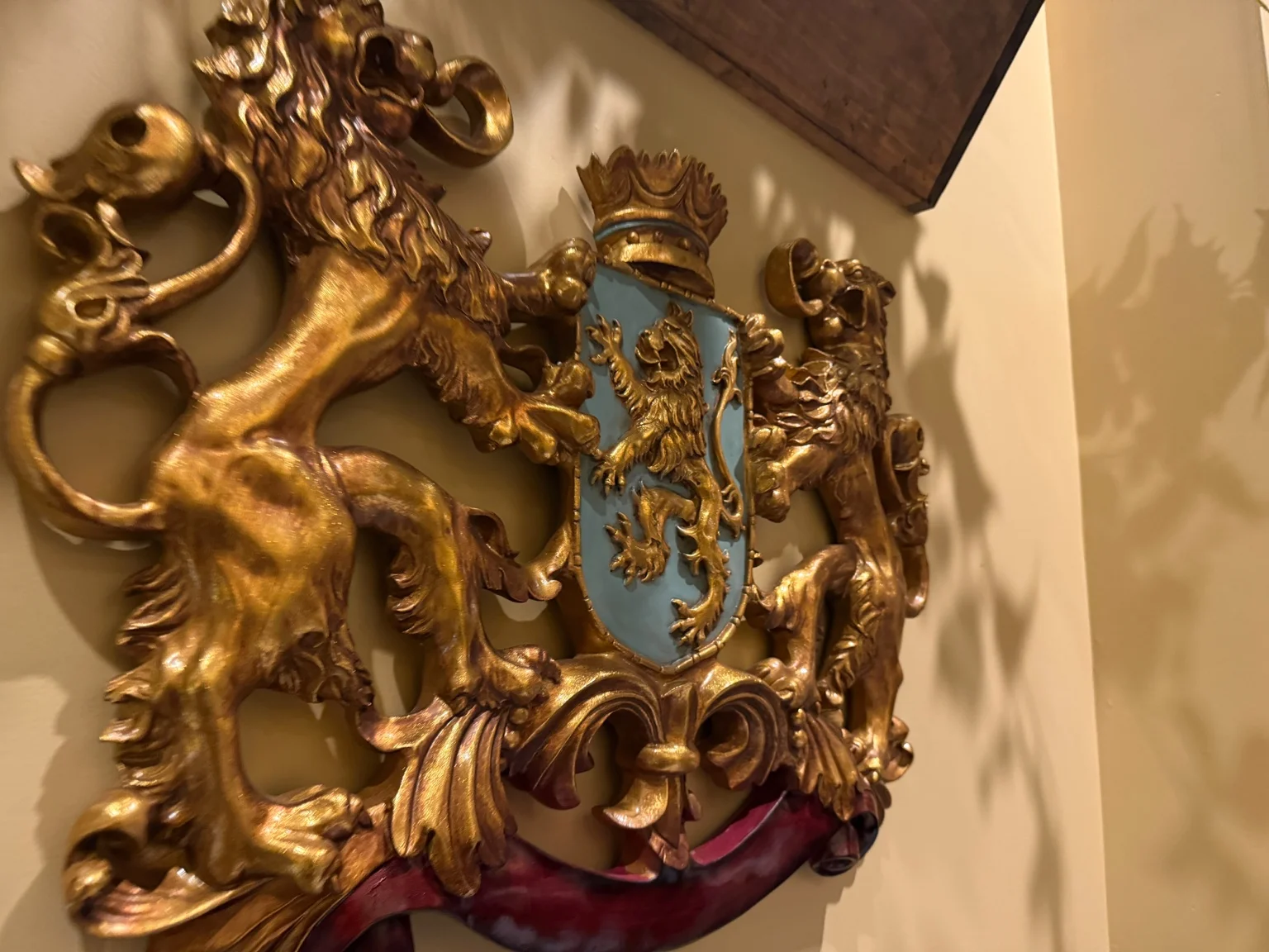 Ornate gold crest decorating Villa Italiana