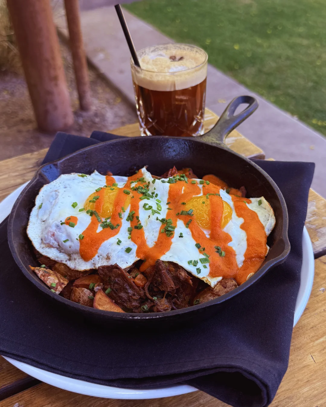 Hearty huevos rancheros served in a cast iron skillet