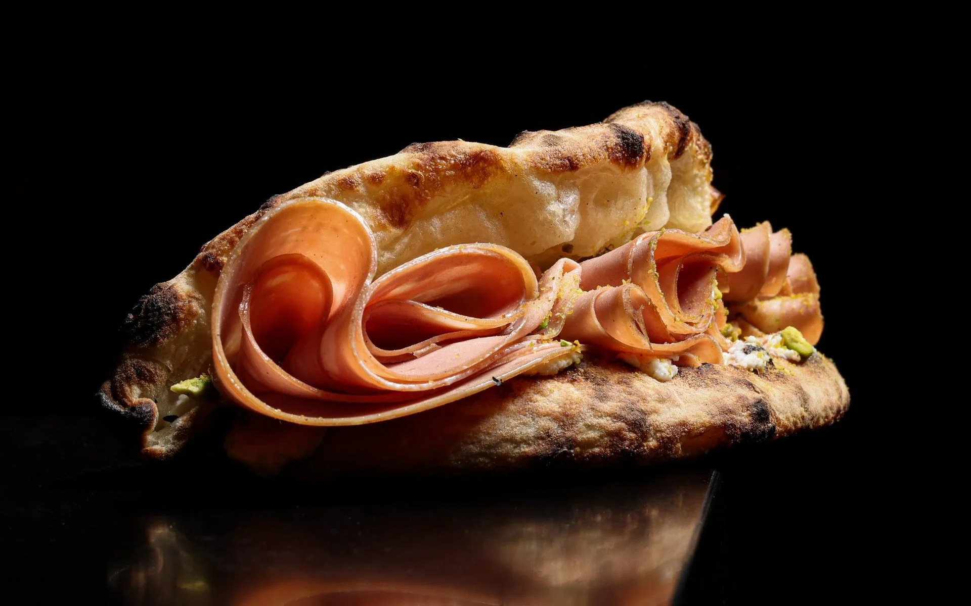 Italian sandwich with cured meats on artisan bread
