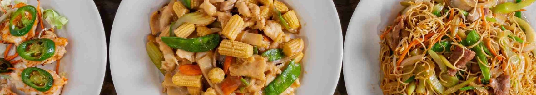 Chinese stir-fried chicken with vegetables and lo mein noodles