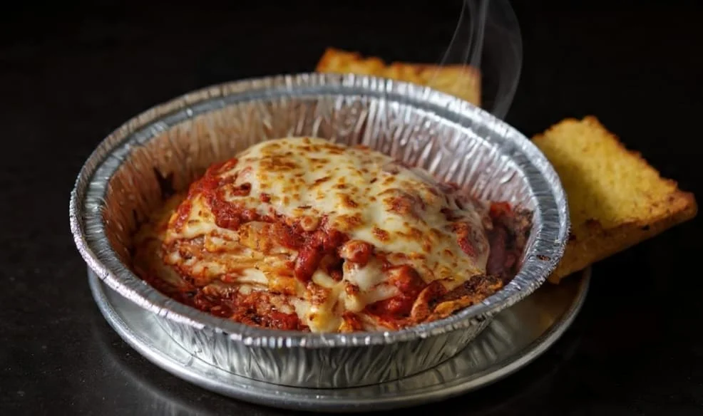 Freshly baked pizzas inside a commercial pizza oven