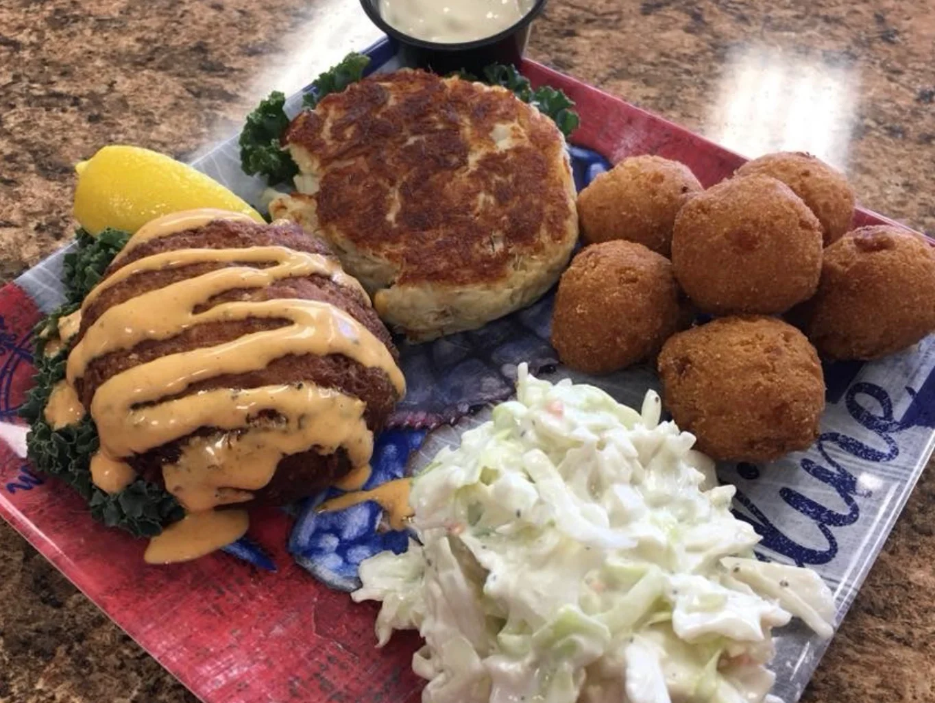 Southern crab cakes with coleslaw and hushpuppies