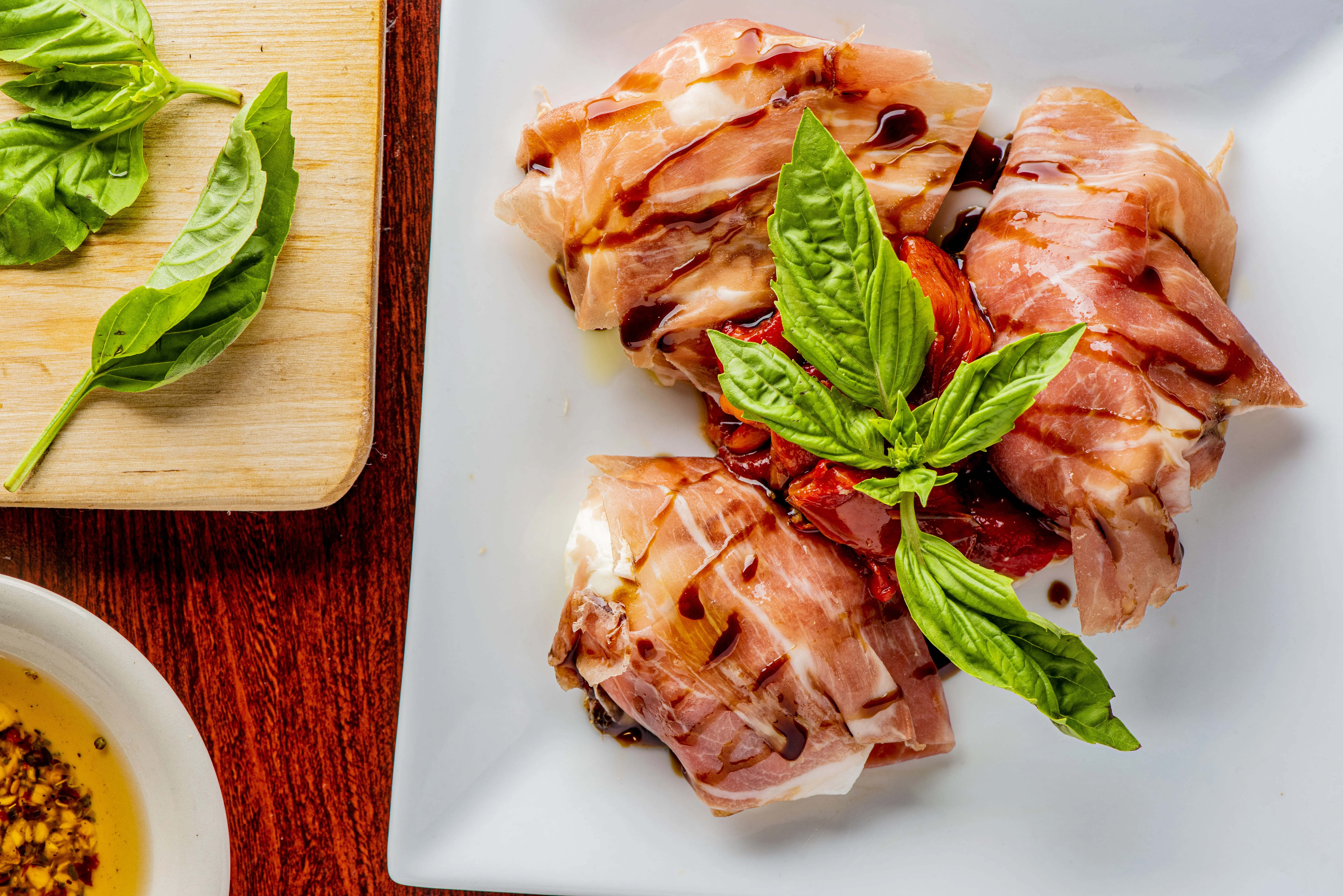 Italian prosciutto-wrapped mozzarella with basil