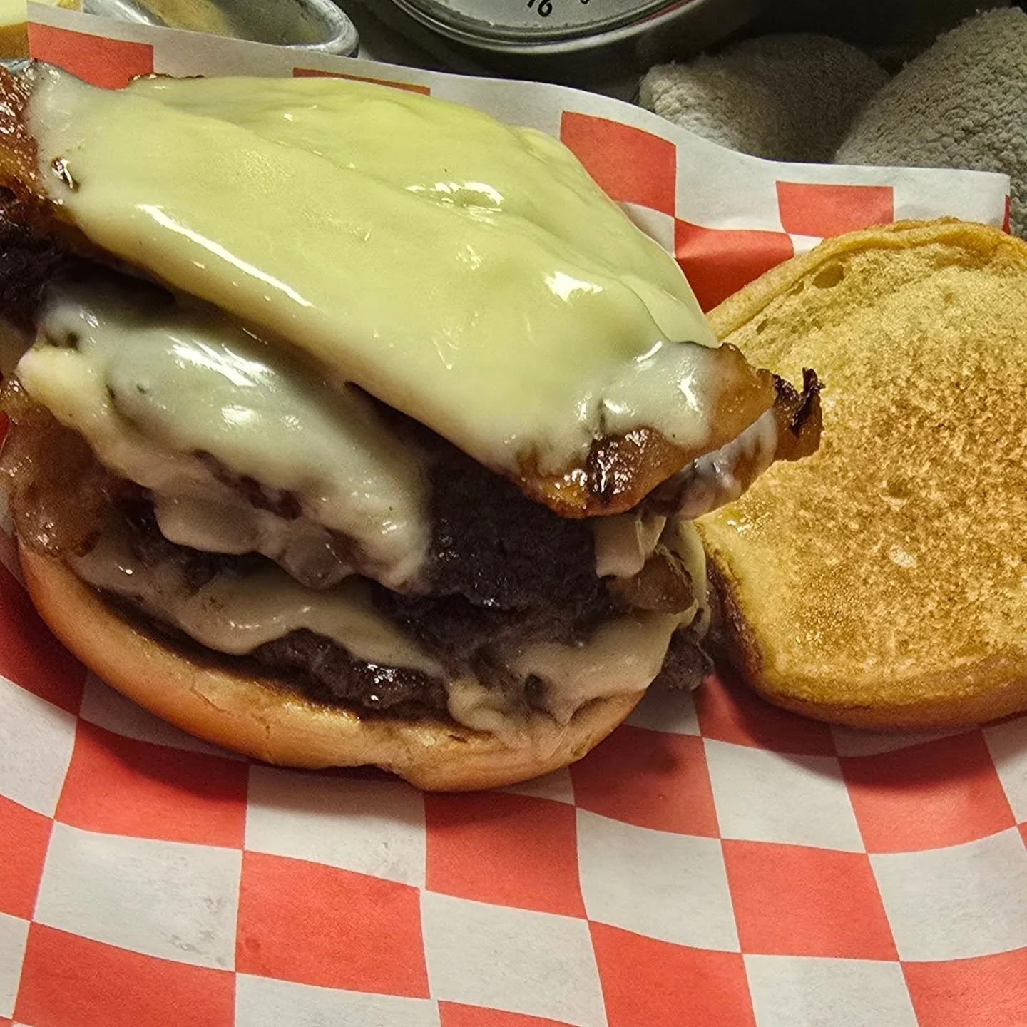 Juicy cheeseburger with melted cheese and crispy bacon