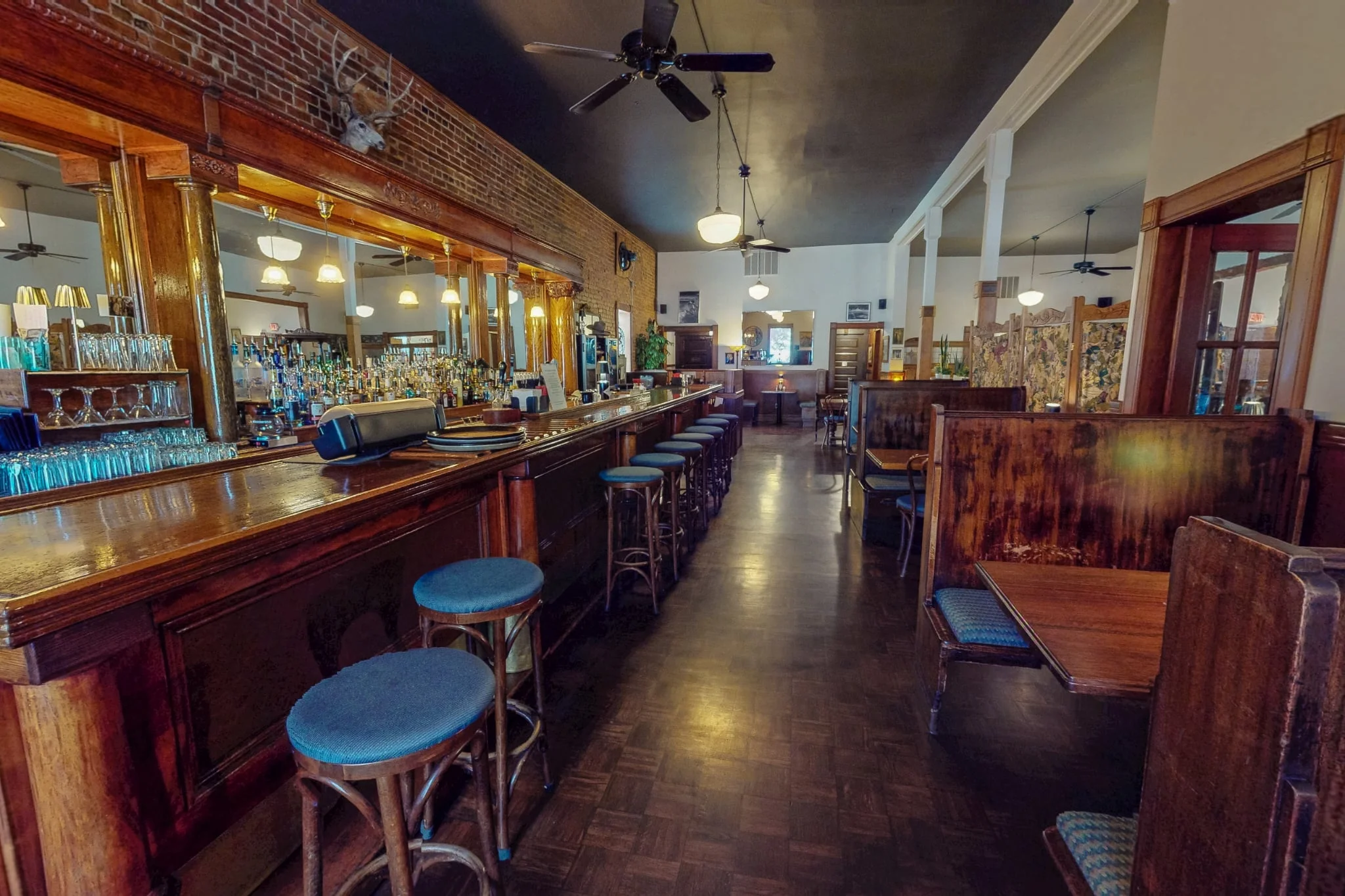 Cozy restaurant interior with wooden bar and warm lighting