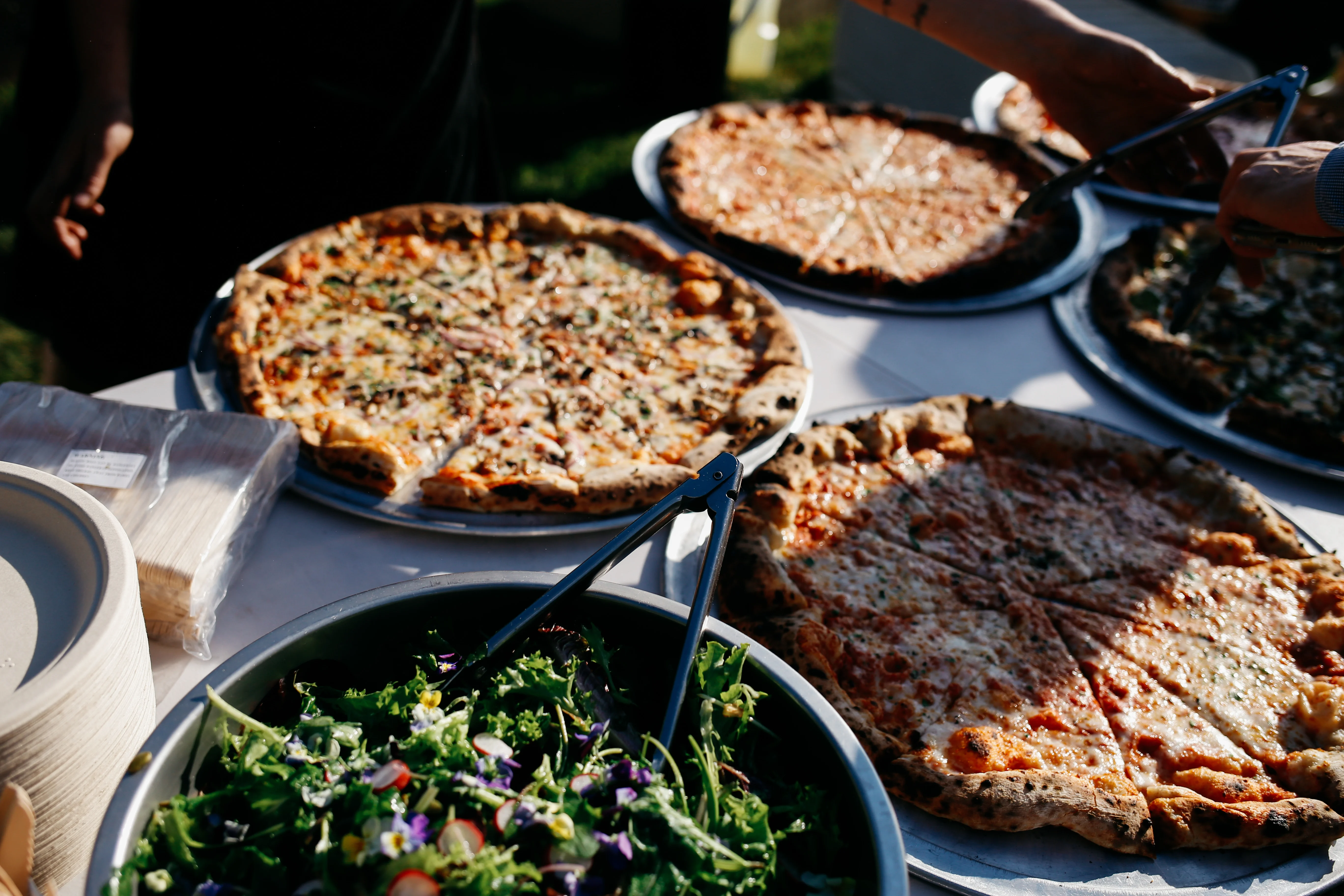 Margherita pizza baking in a wood-fired oven