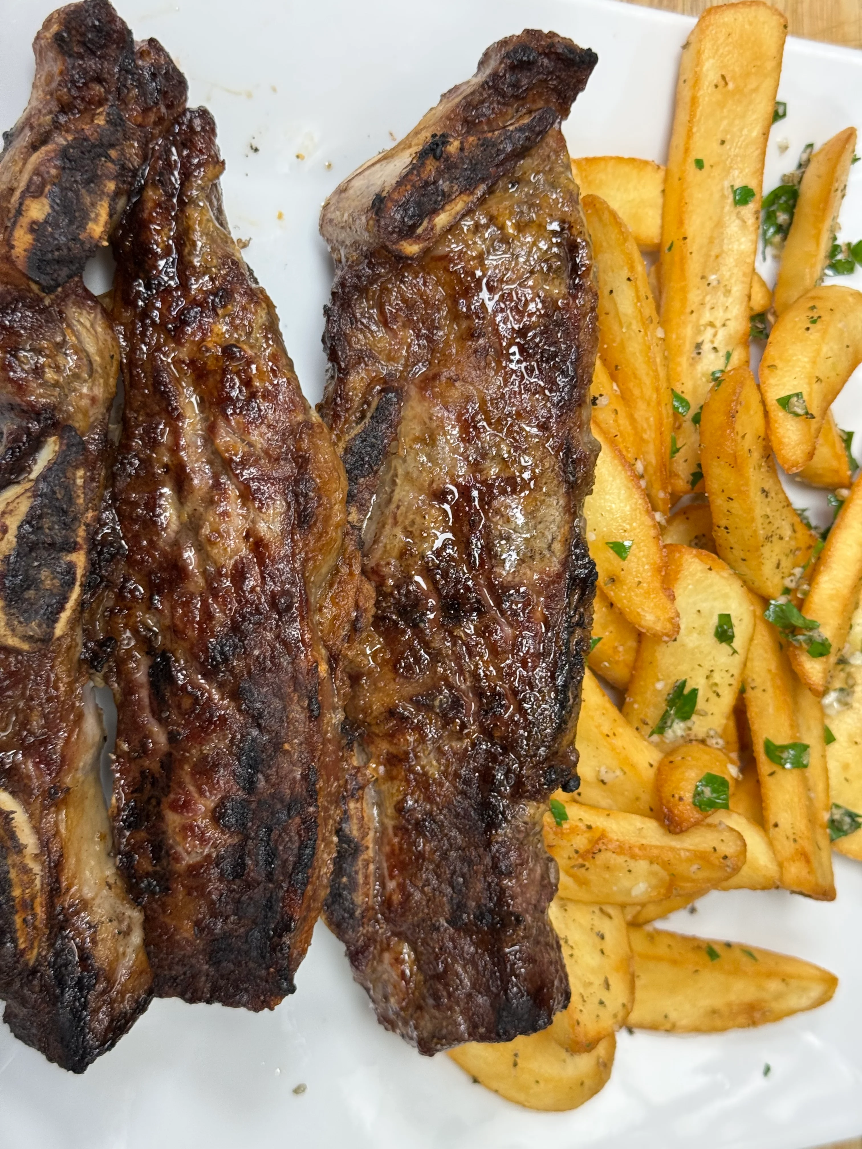Grilled Argentine asado with crispy fries