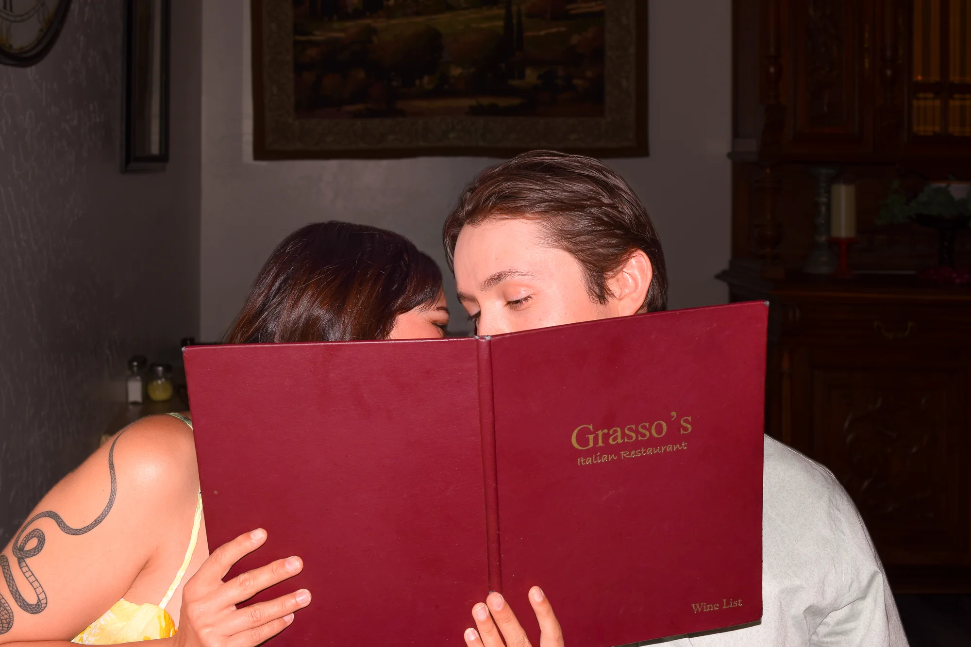 Couple sharing a moment at an Italian restaurant