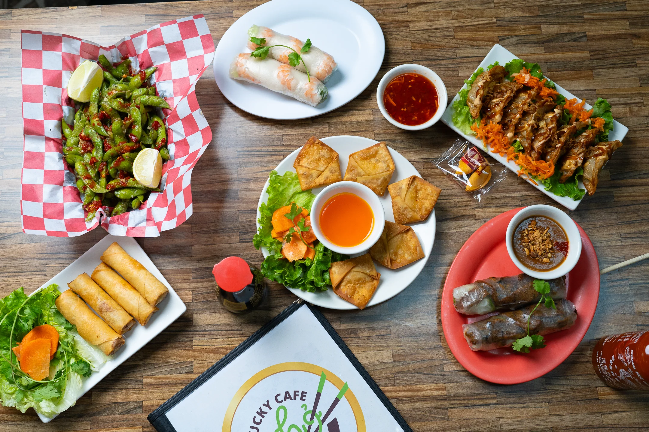 Assorted Vietnamese appetizers including spring rolls and dumplings