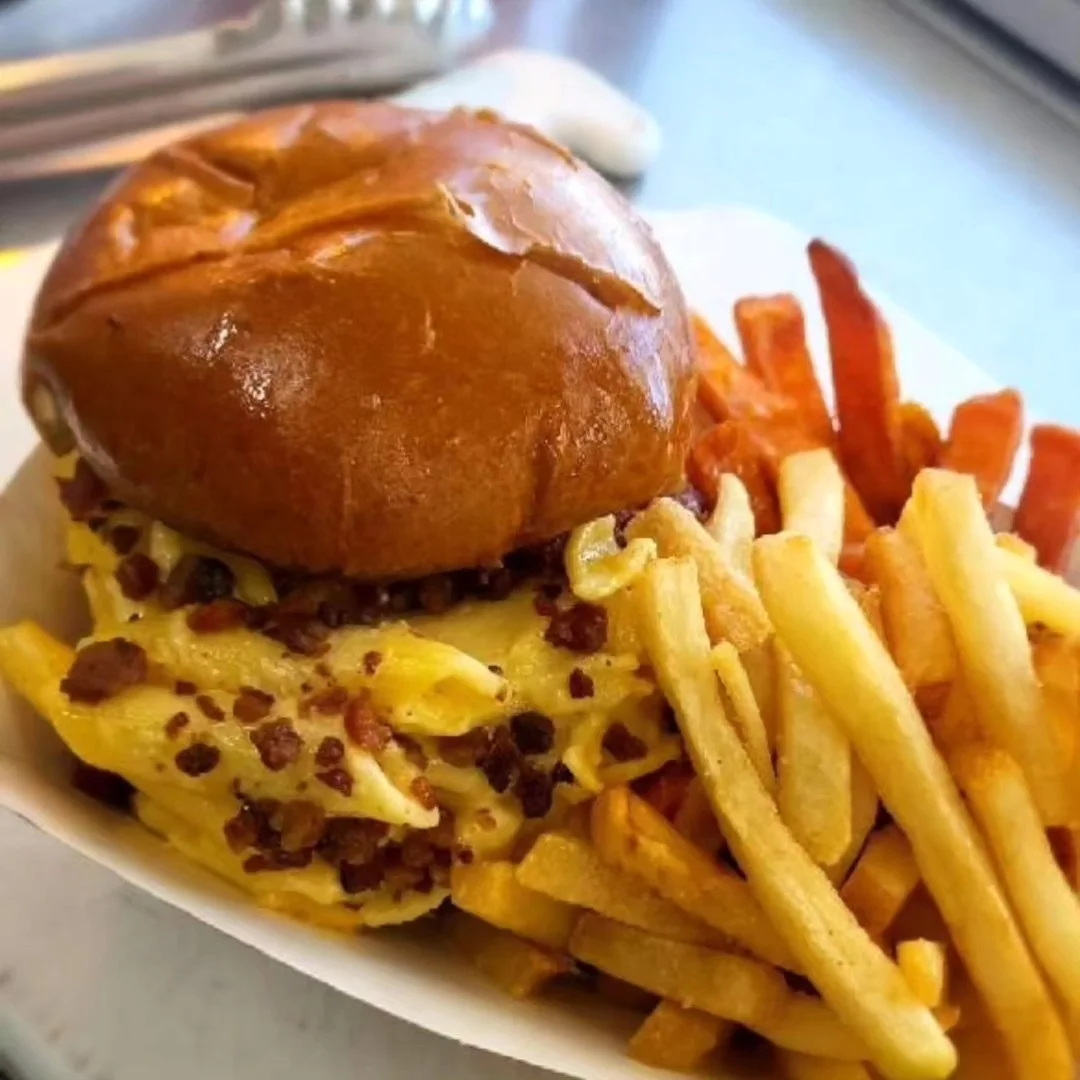 Decadent mac and cheese burger with fries
