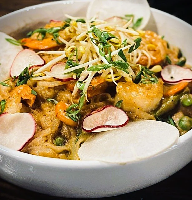 Shrimp pad thai with fresh herbs and vegetables