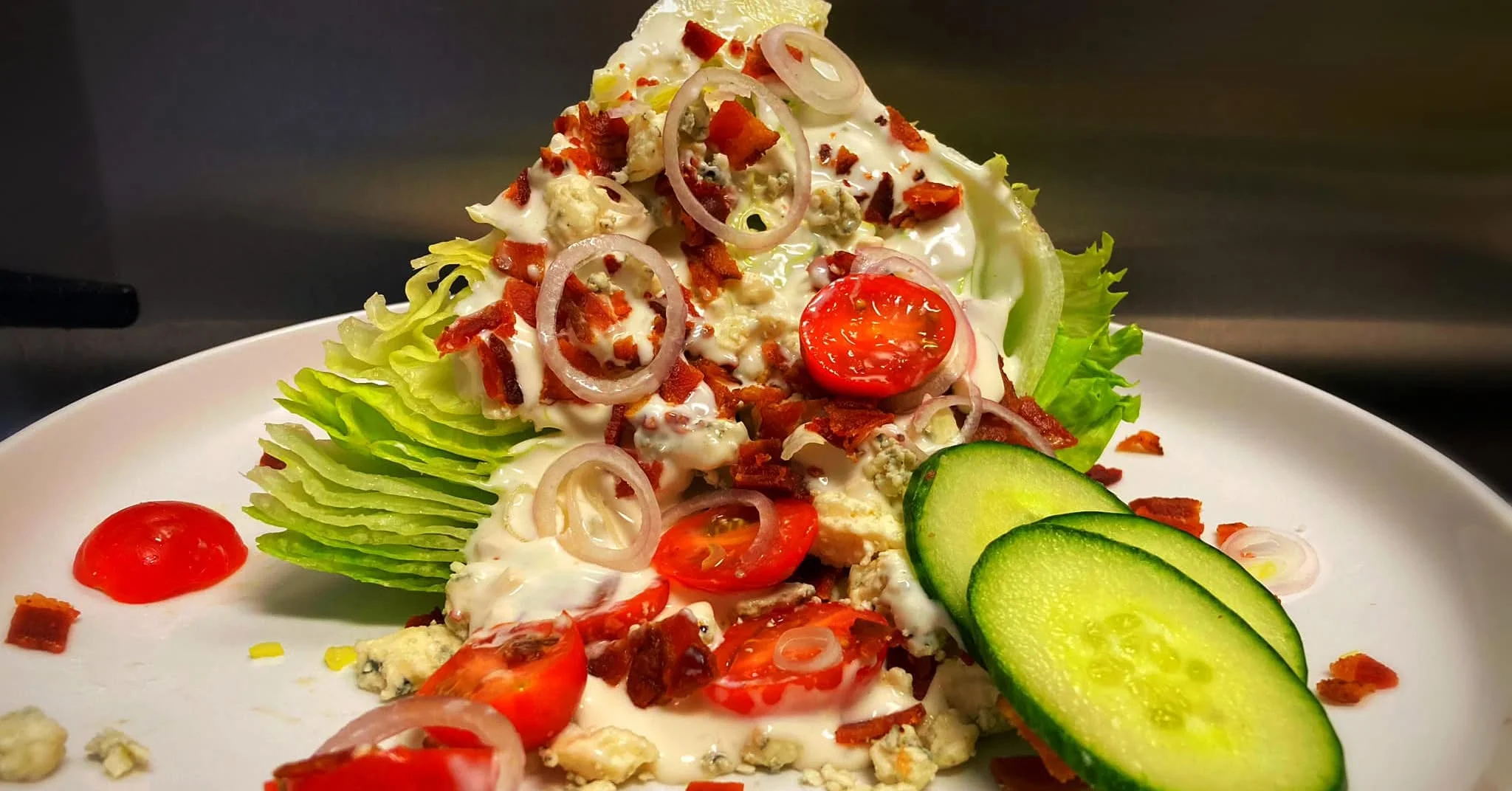 Delicious gourmet burger with fresh toppings on a wooden table