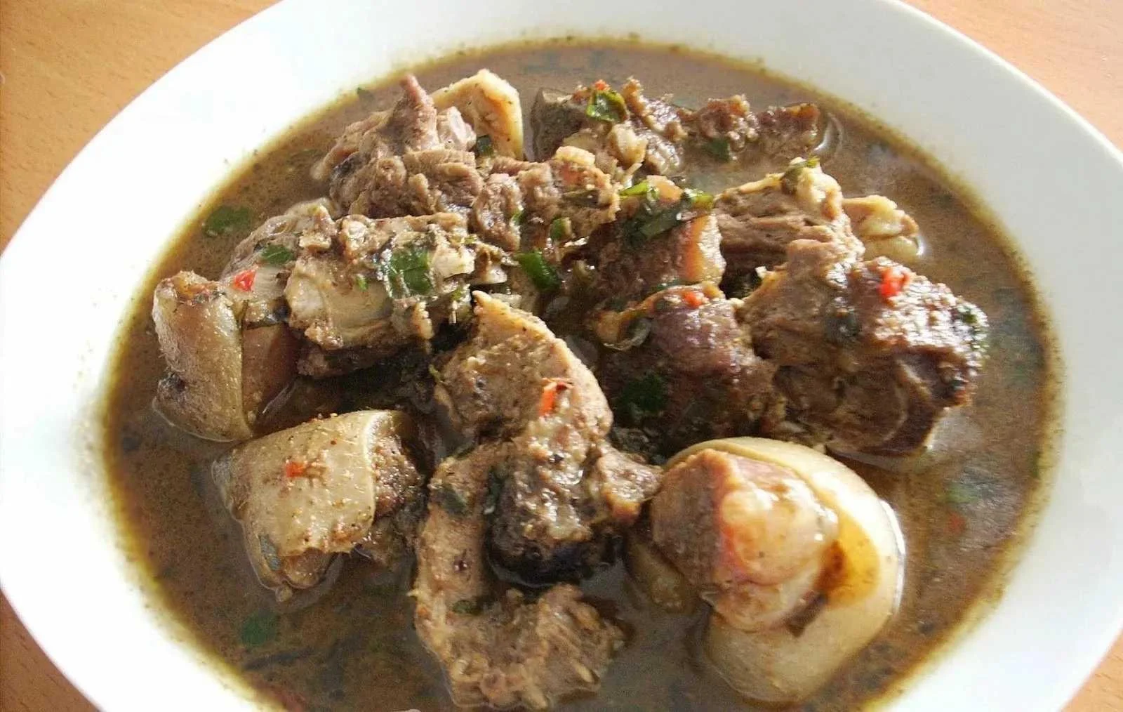 Nigerian oxtail pepper soup in a bowl