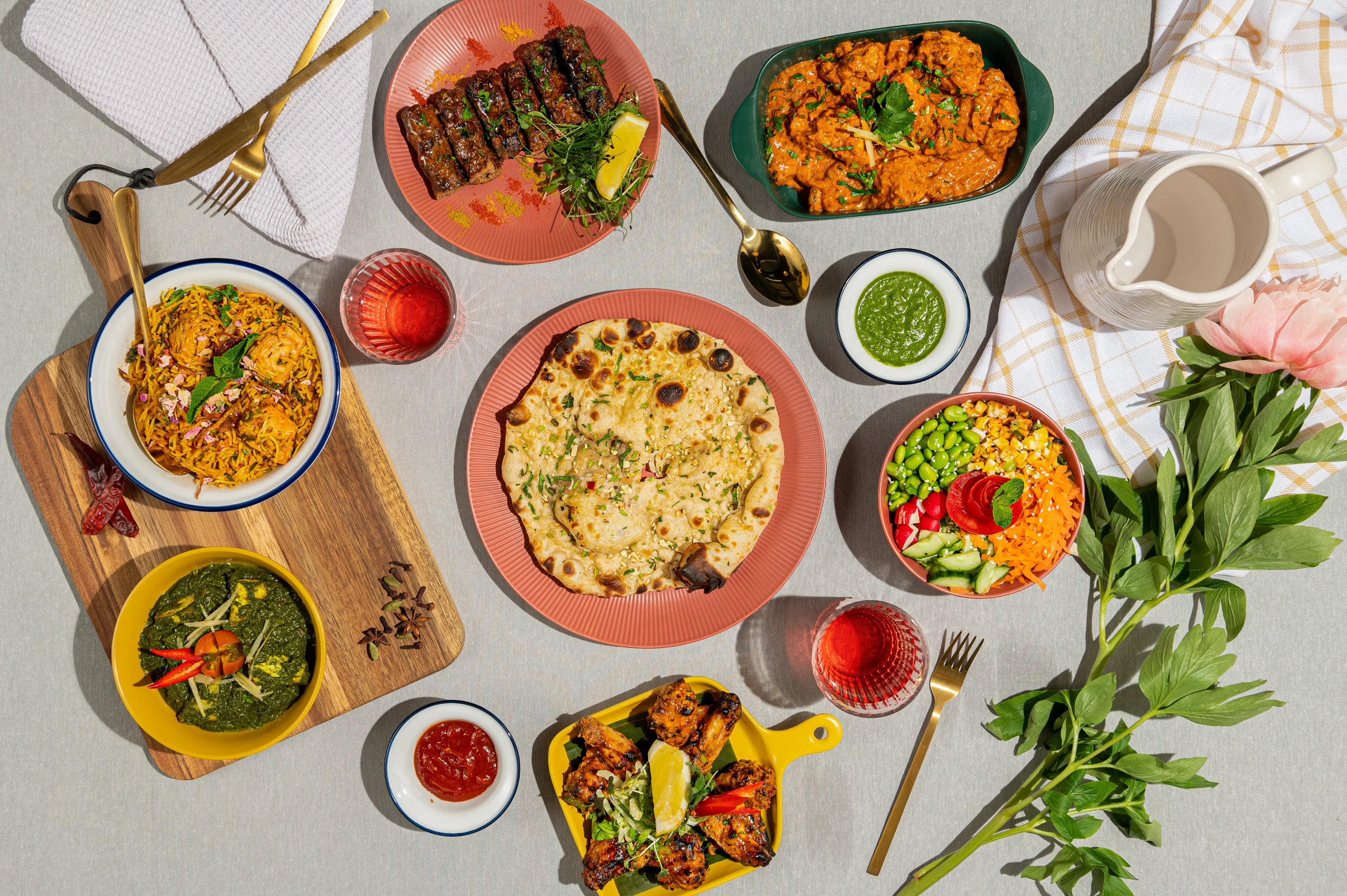 Indian feast featuring biryani, naan, and kebabs