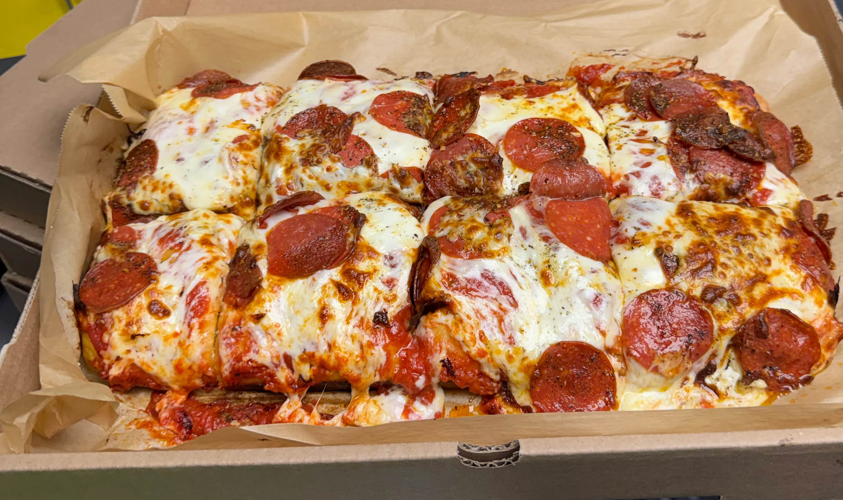 Delicious foccacia pizza topped with fresh ingredients.