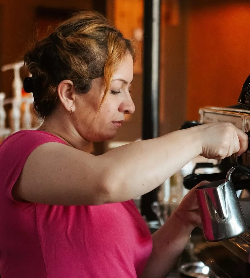 Barista preparing espresso at a coffee shop