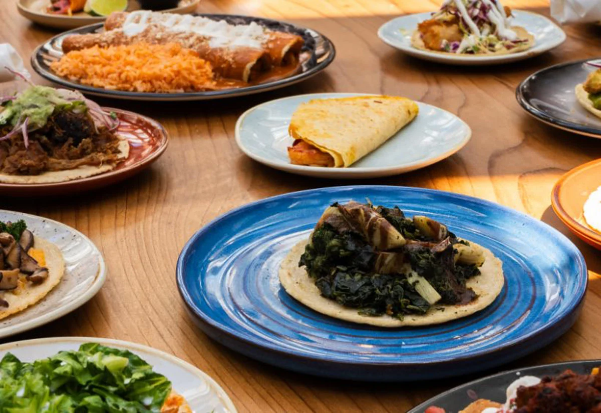 Colorful Mexican taco platter with various fillings