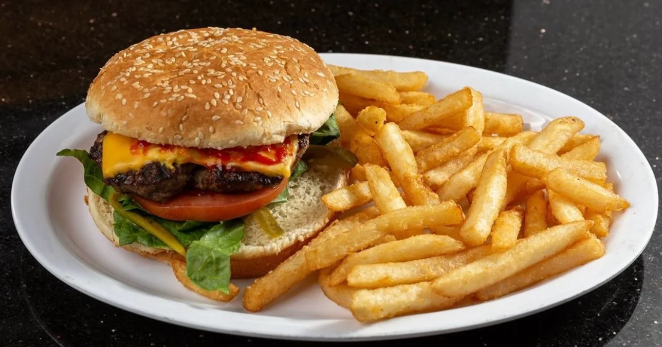 Classic American cheeseburger with fries