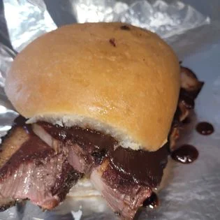 Smoked brisket sandwich with barbecue sauce