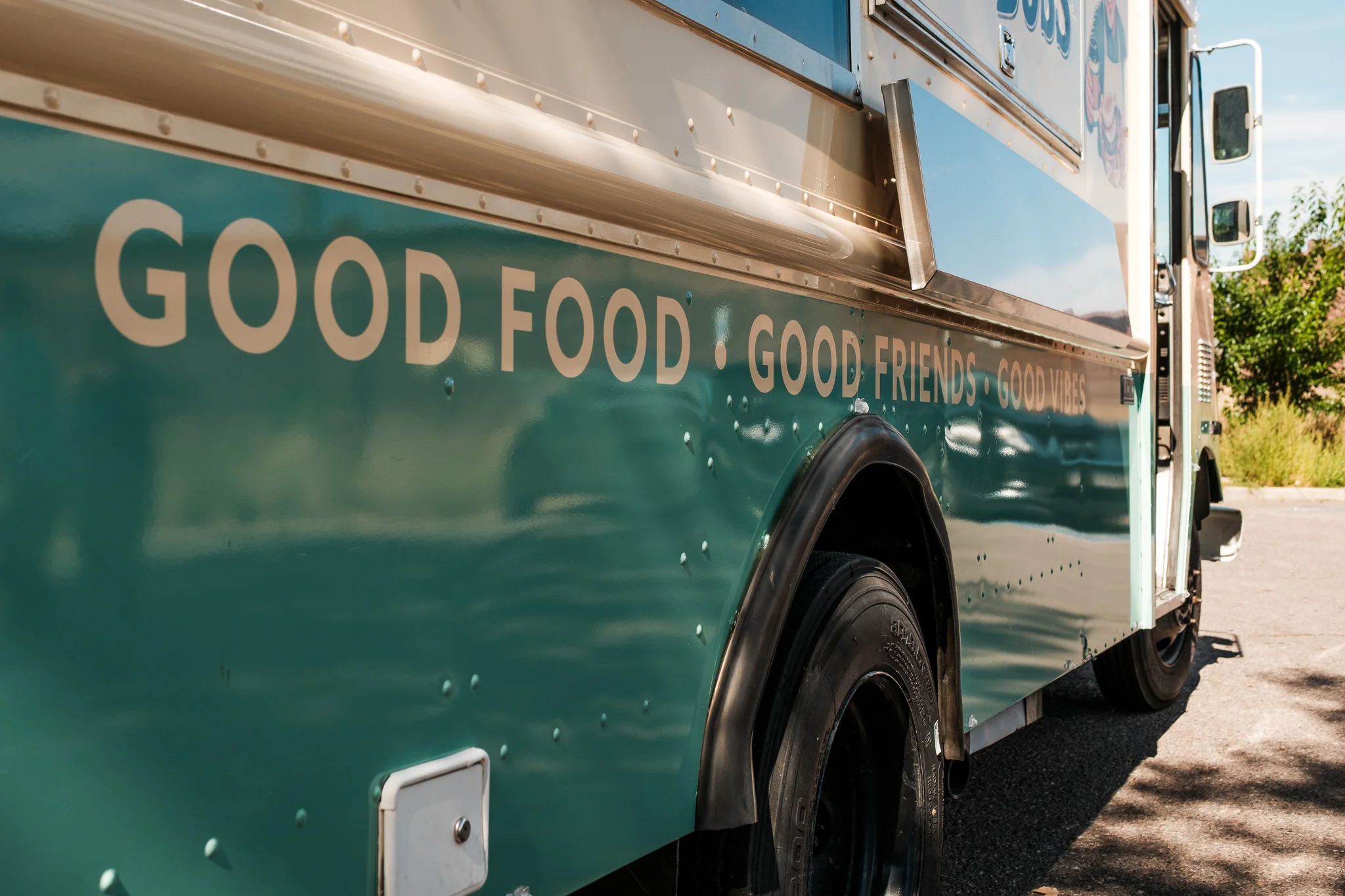 Food truck with vibrant colors and positive messaging